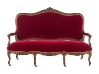 An Italian Louis XV Style Carved and Parcel Gilt Walnut Parlor Suite