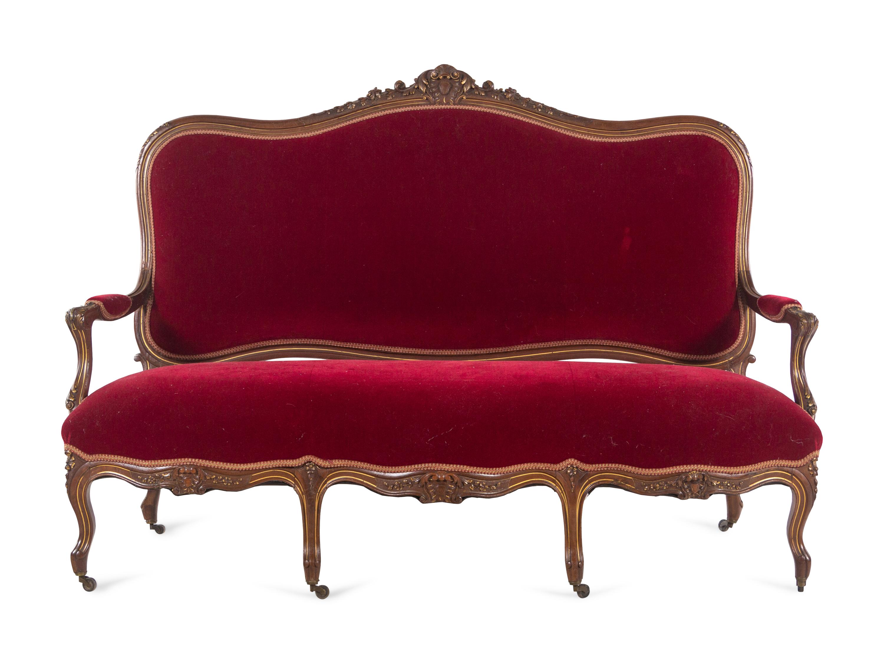 An Italian Louis XV Style Carved and Parcel Gilt Walnut Parlor Suite