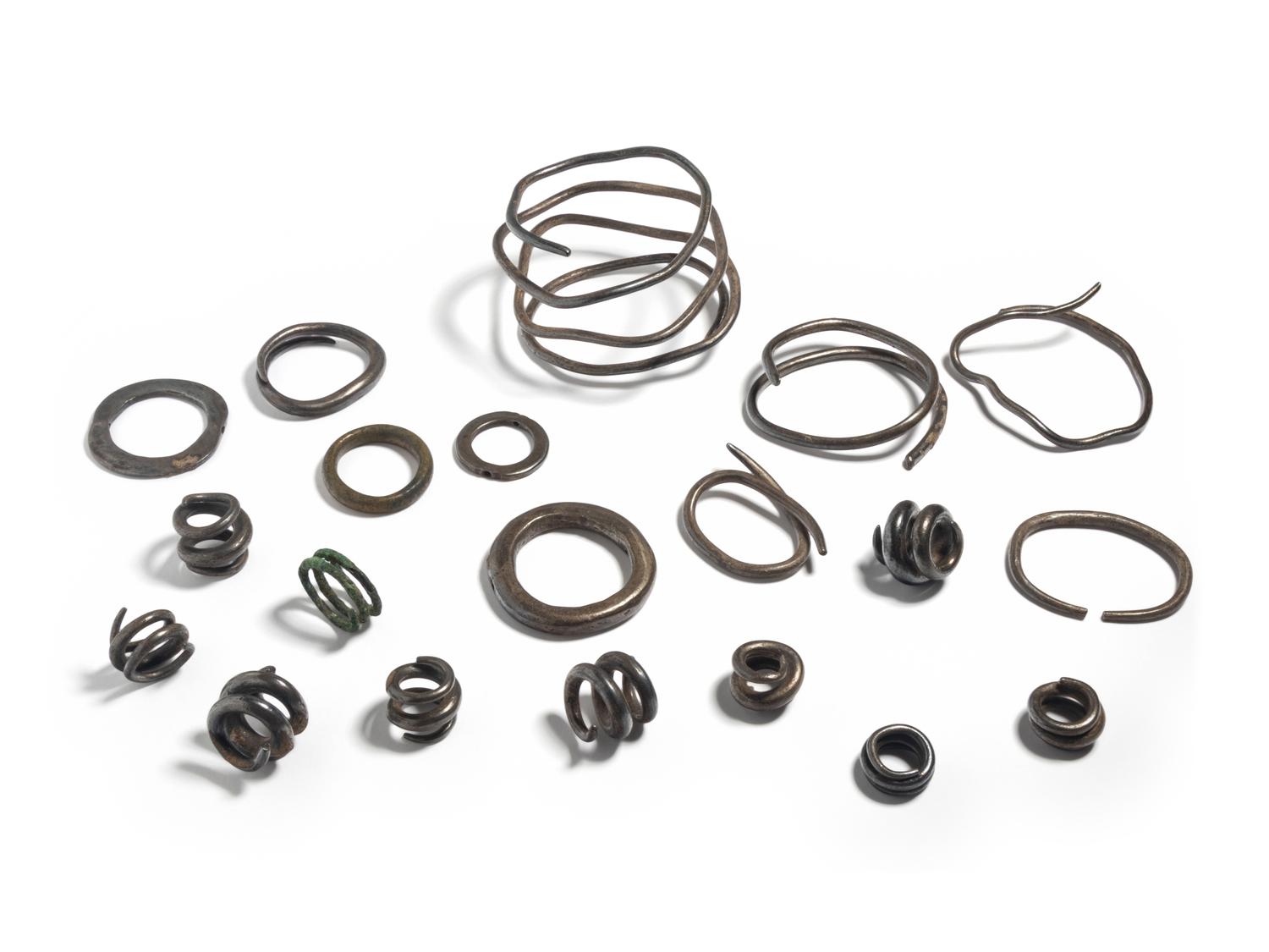 A Collection of European Bronze Age Jewelry — (solid silver hair rings and arm bands)