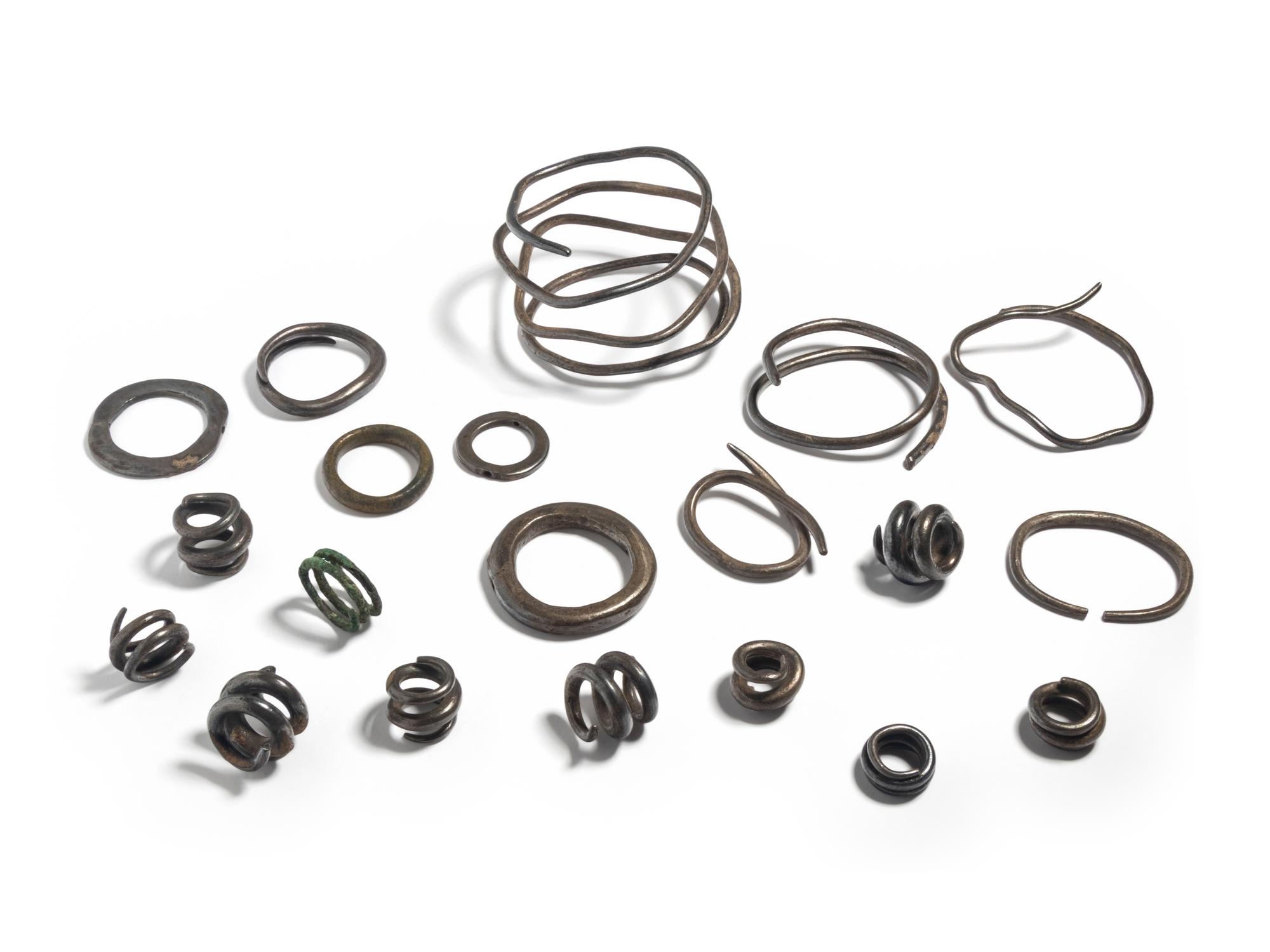 A Collection of European Bronze Age Jewelry — (solid silver hair rings and arm bands)