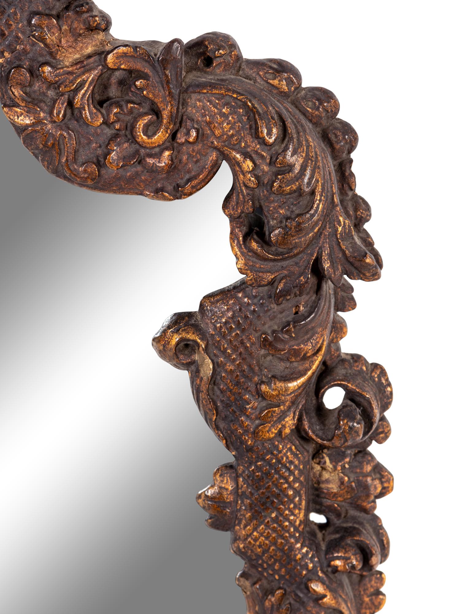 An Italian Baroque Style Giltwood Mirror