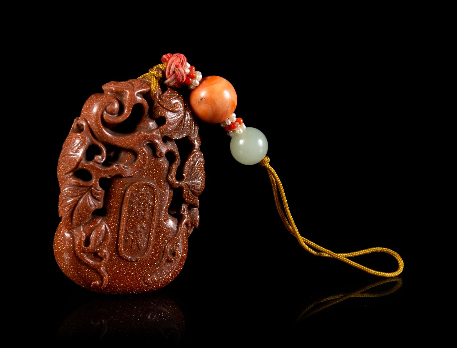 A Gold Splashed Glass Gourd-Form Pendant