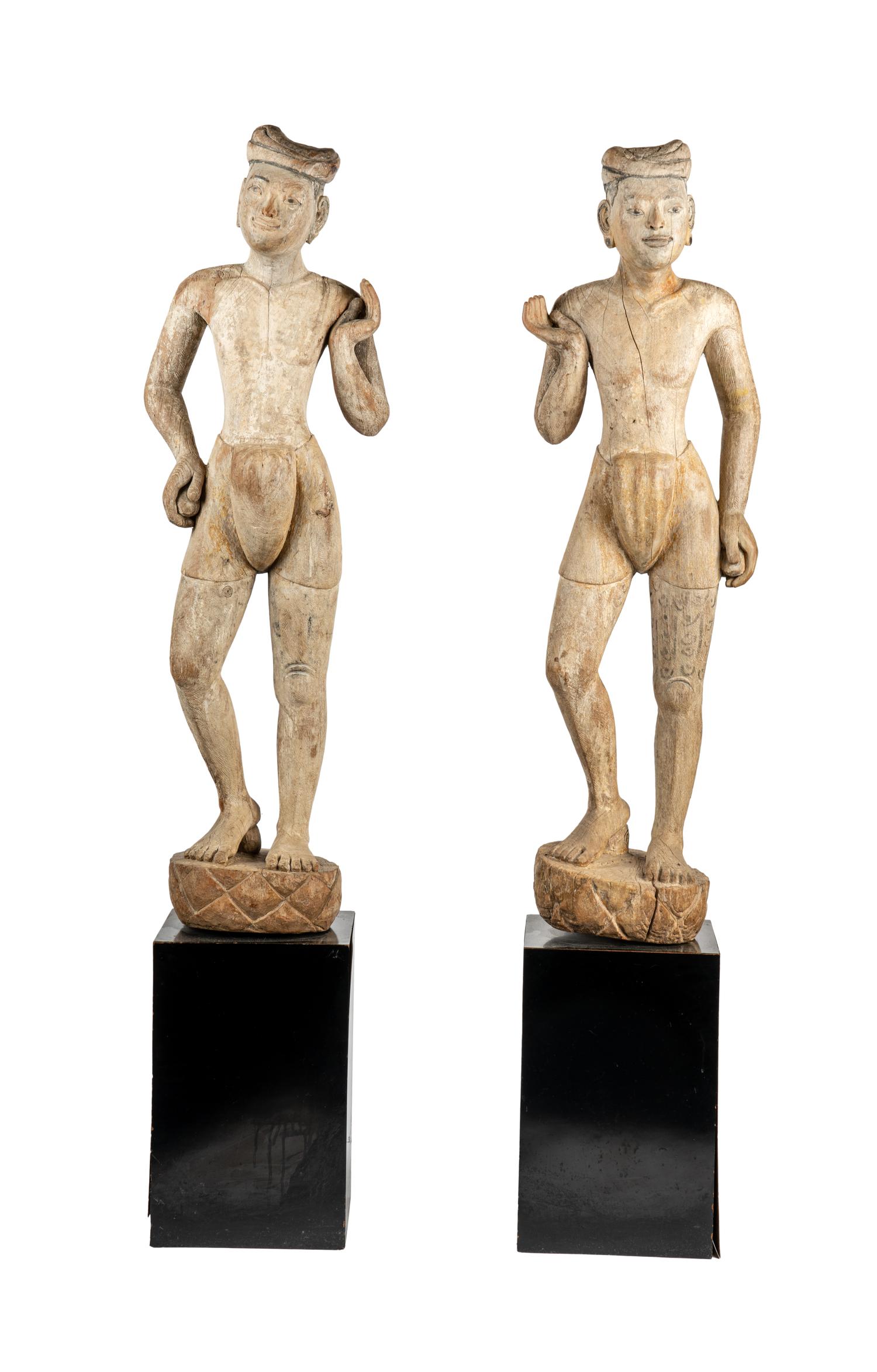 A Pair of Burmese Mandalay Carved and Painted Wood Figures