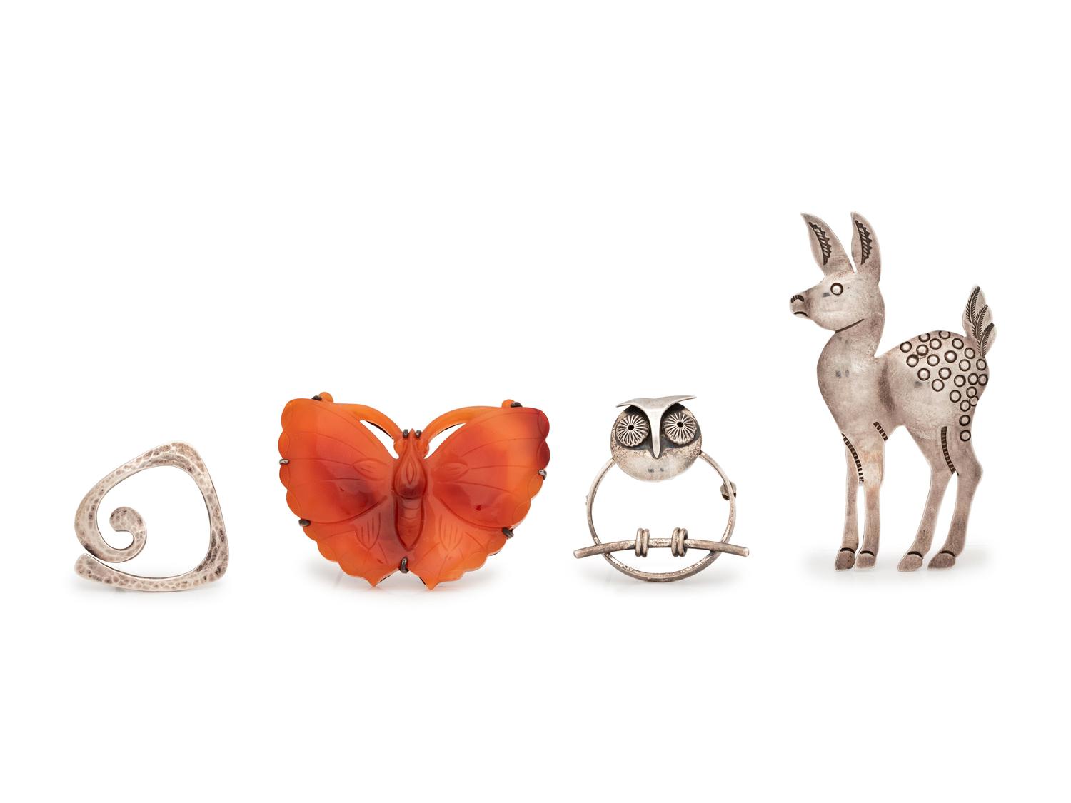 A Collection of Silver Brooches,