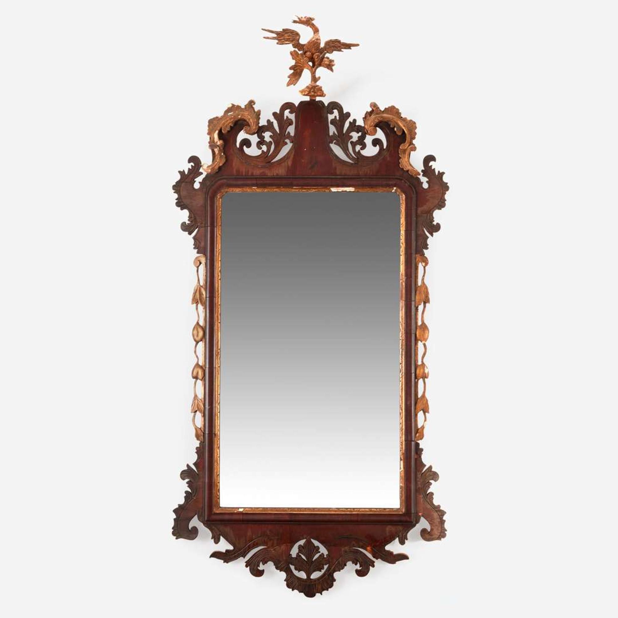 A Chippendale fret-carved mahogany and parcel-gilt looking glass 18th / 19th century