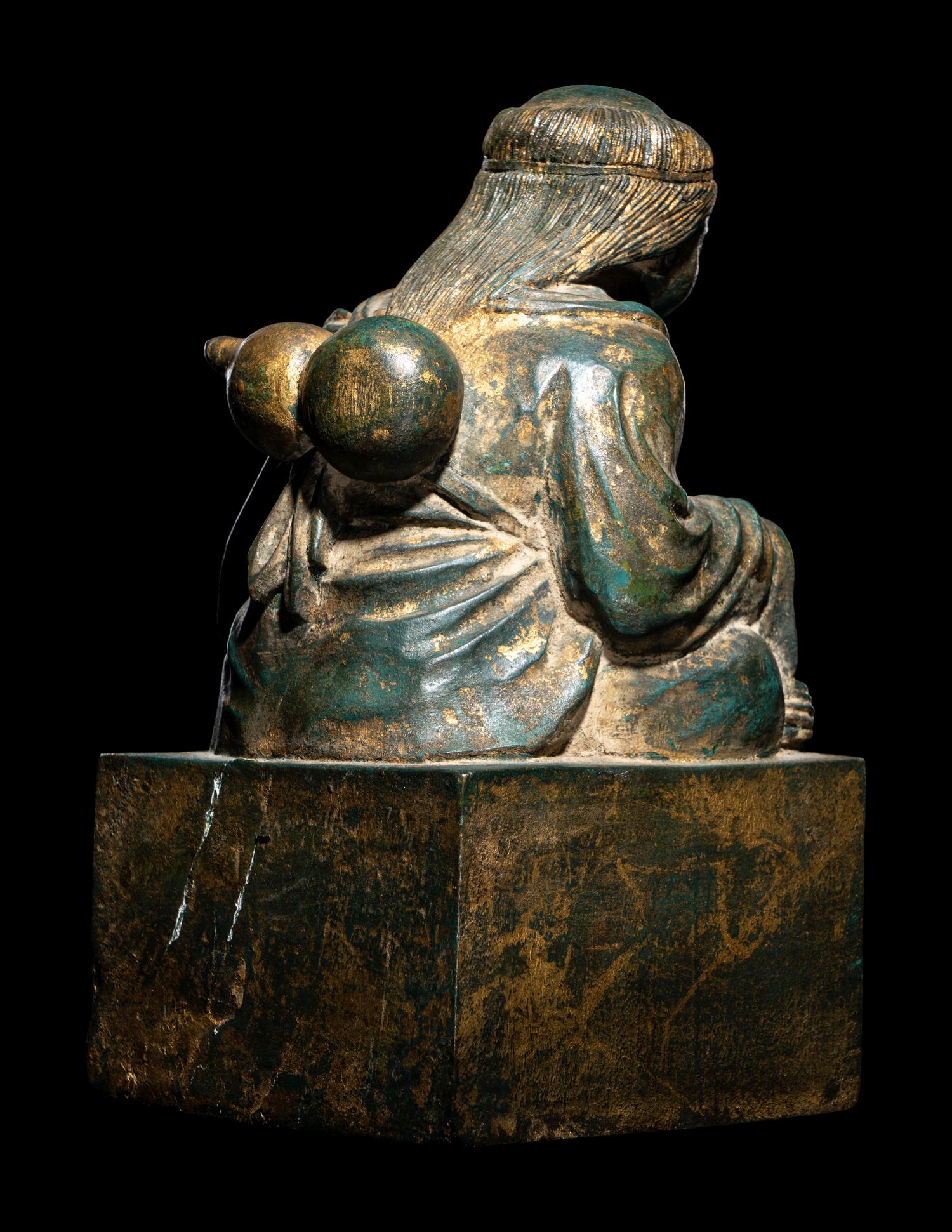 An Unusual Set of Two Parcel-Gilt Wood ' Liuhai and Toad' Seals