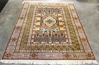 A Group of Four Wool Rugs Dimensions of largest 9 feet 7 inches x 6 feet 4 inches.