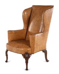 A Georgian Style Faux Leather Upholstered Walnut Wing Chair