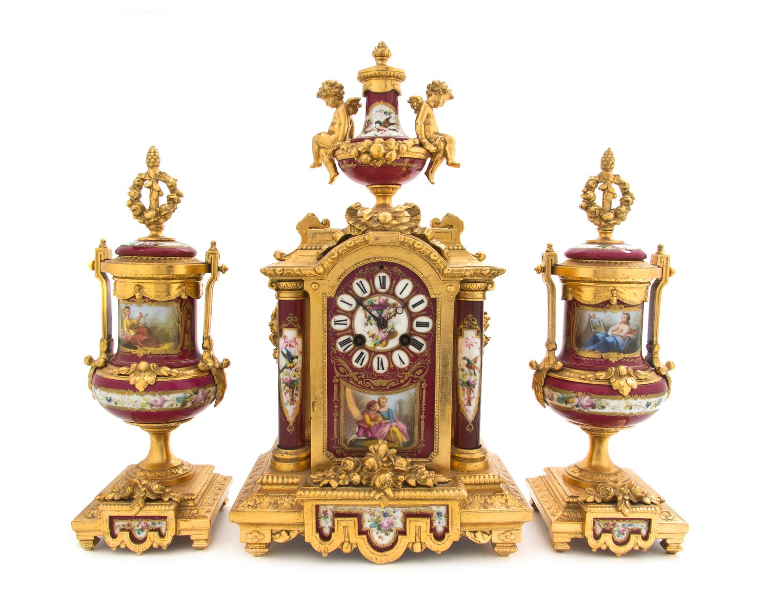 A Sevres Style Porcelain and Gilt Metal Mounted Clock Garniture, Height of clock 17 inches.