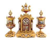 A Sevres Style Porcelain and Gilt Metal Mounted Clock Garniture, Height of clock 17 inches.