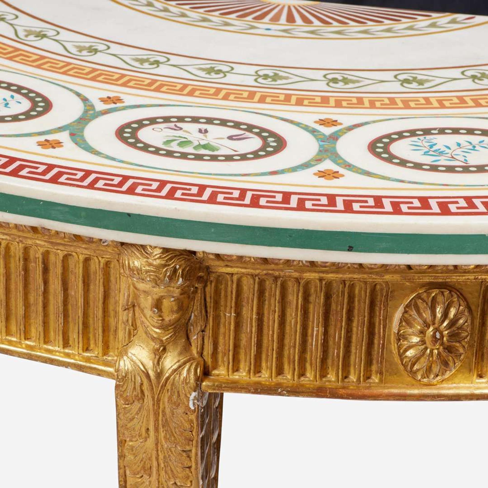 A pair of George III scagliola inlaid and giltwood demilune tables circa 1780