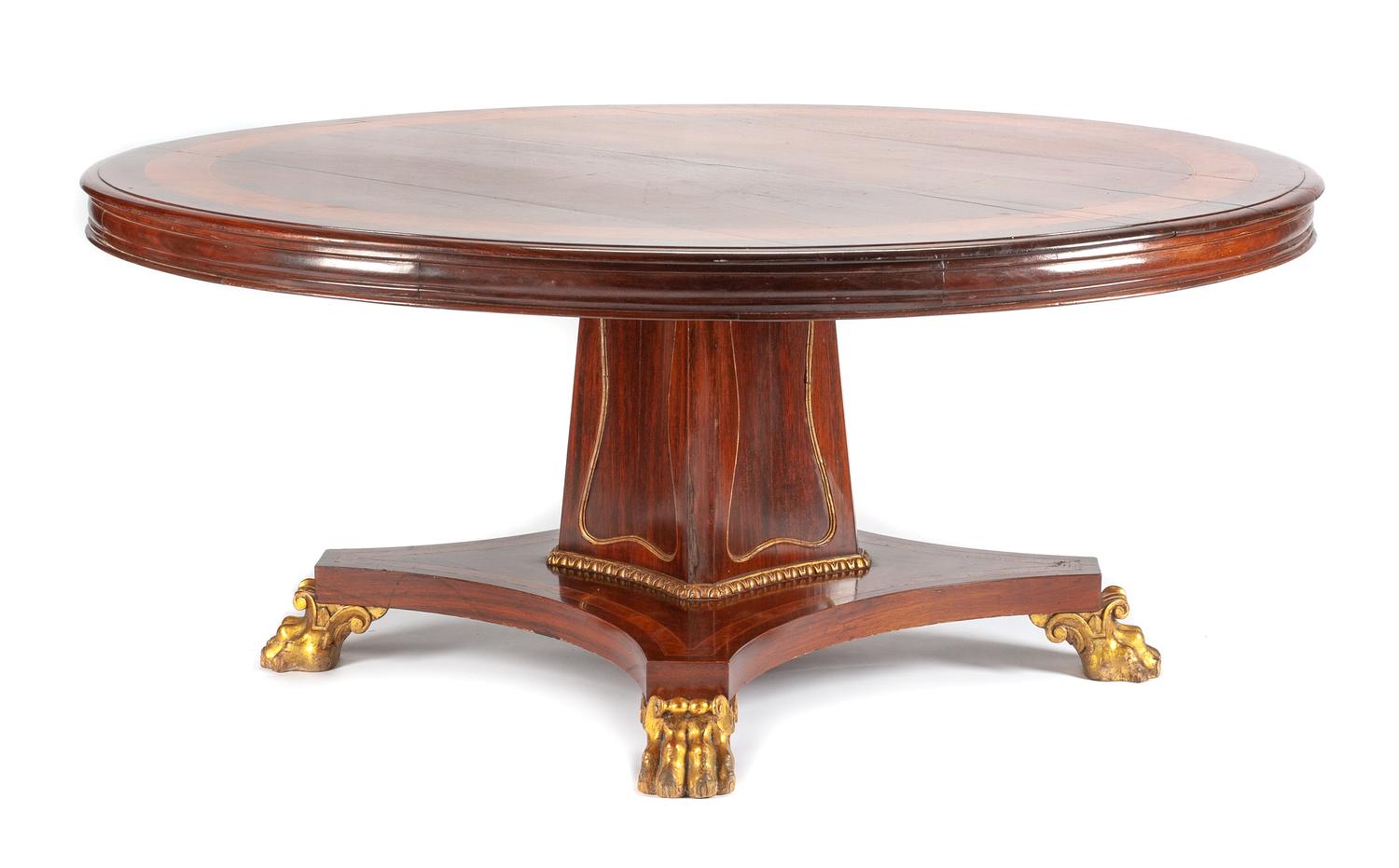 A Regency Style Parcel Gilt Mahogany Dining Table Height 30 1/2 x diameter of top 71 inches.