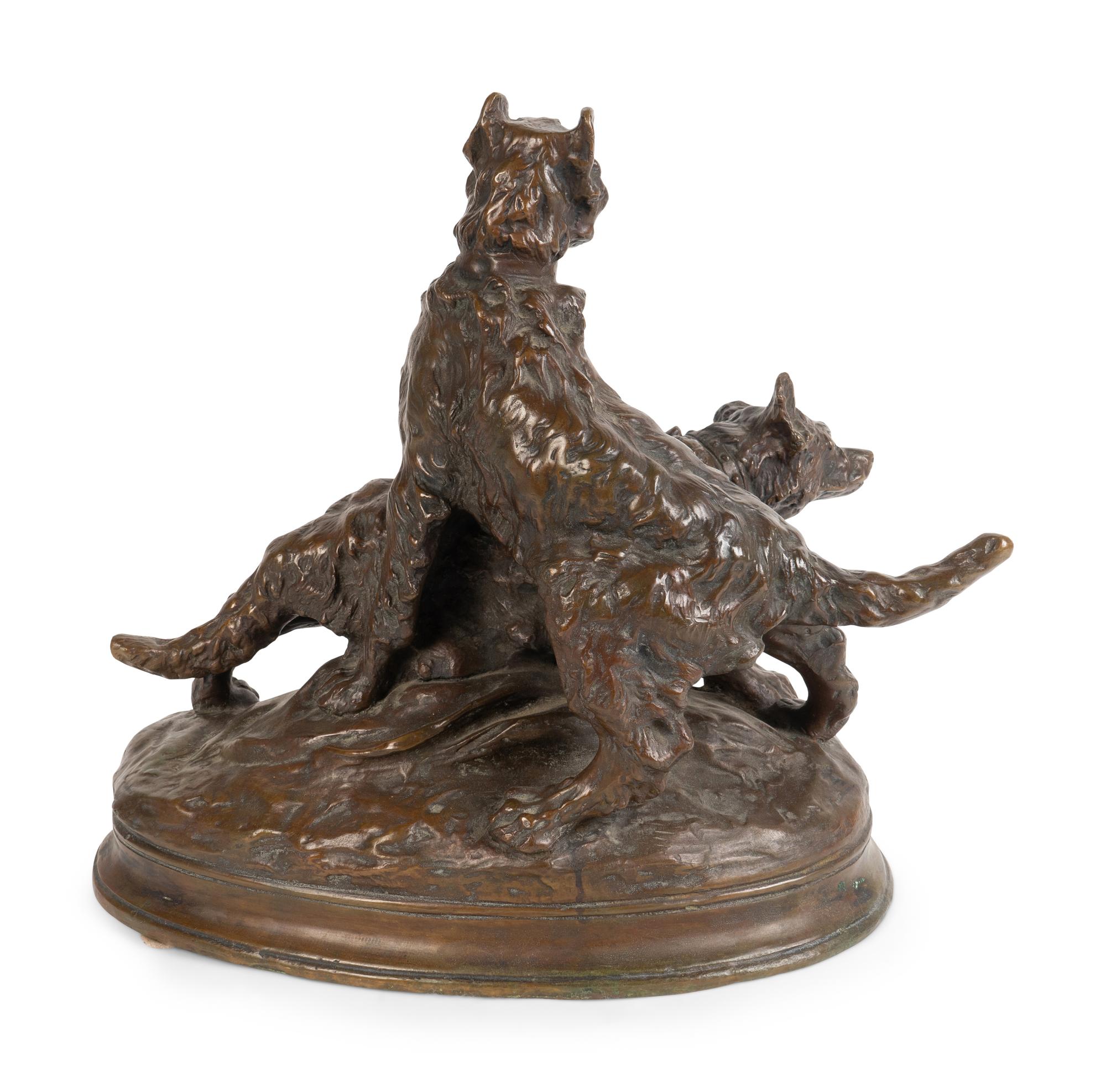 A French Patinated Bronze Group of Dogs — CAST AFTER A MODEL BY THOMAS FRANCOIS CARTIER (FRENCH, 1879-1943)