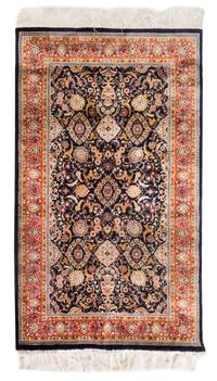 A Silk Rug 5 feet 1 inch x 3 feet 1 inch.