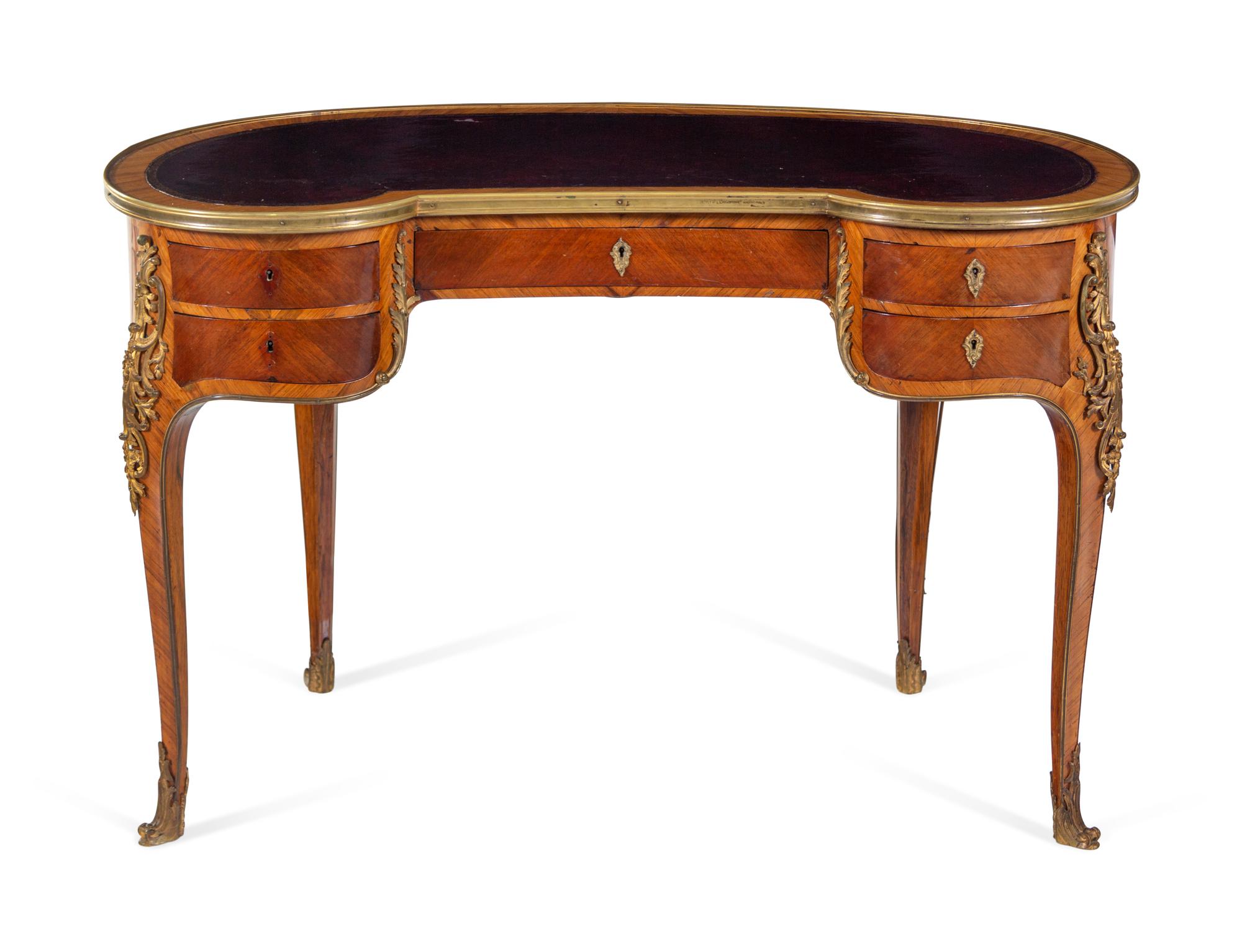 A Louis XV Style Gilt Bronze Mounted Kingwood Reniform Bureau Plat