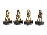 A Group of Four Brass Skeleton Clocks