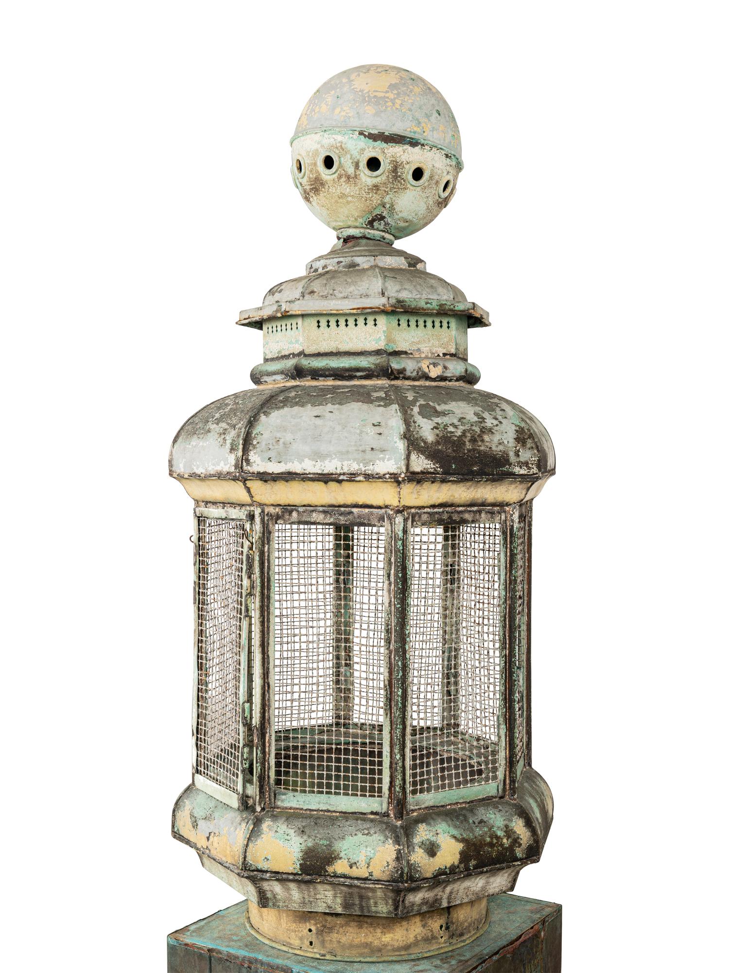 A Pair of Weathered Painted Sheet Metal Lanterns Converted to Bird Cages
