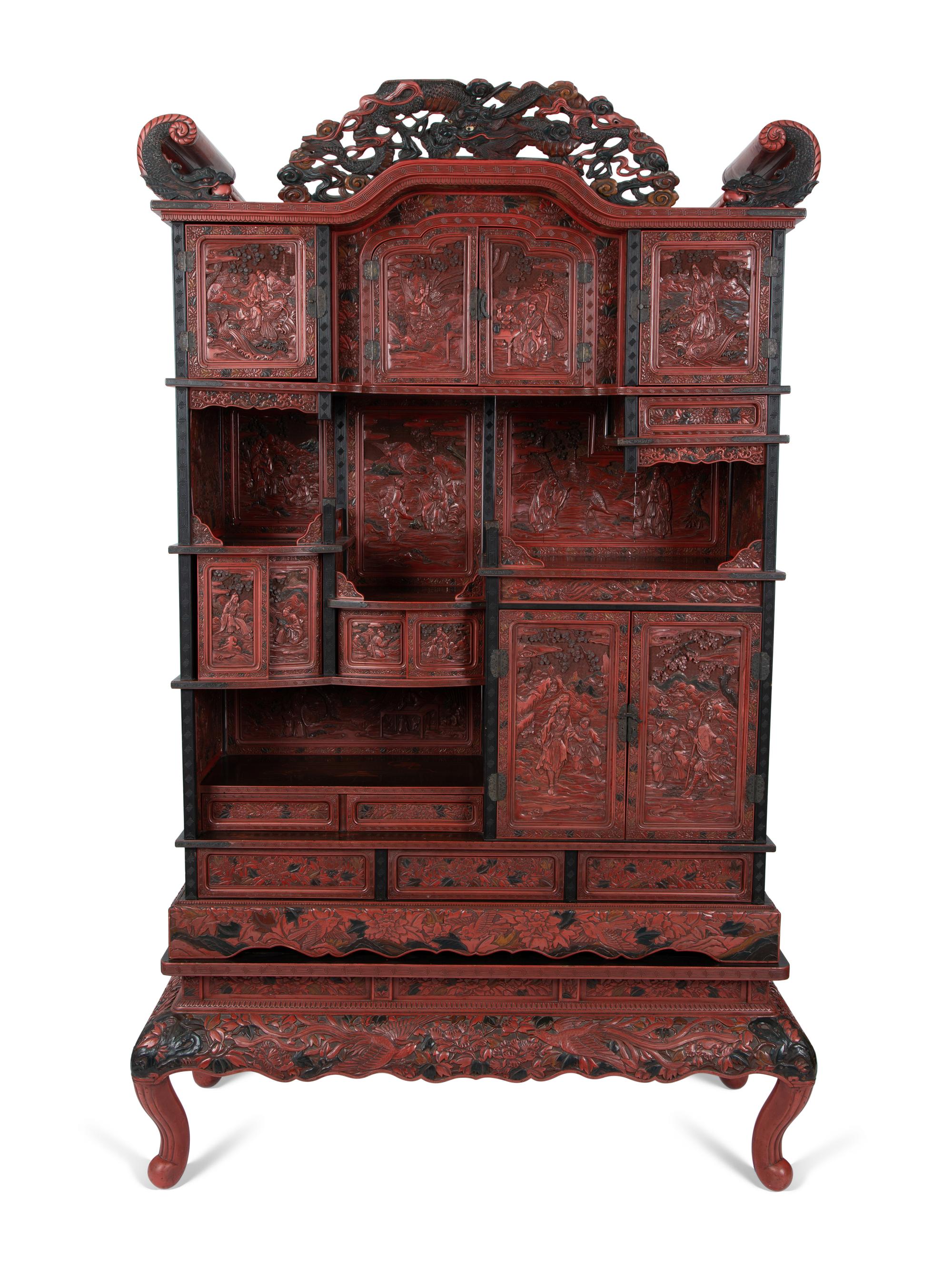 A Chinese Export Carved Red Lacquer Curio Cabinet — EARLY 20TH CENTURY
