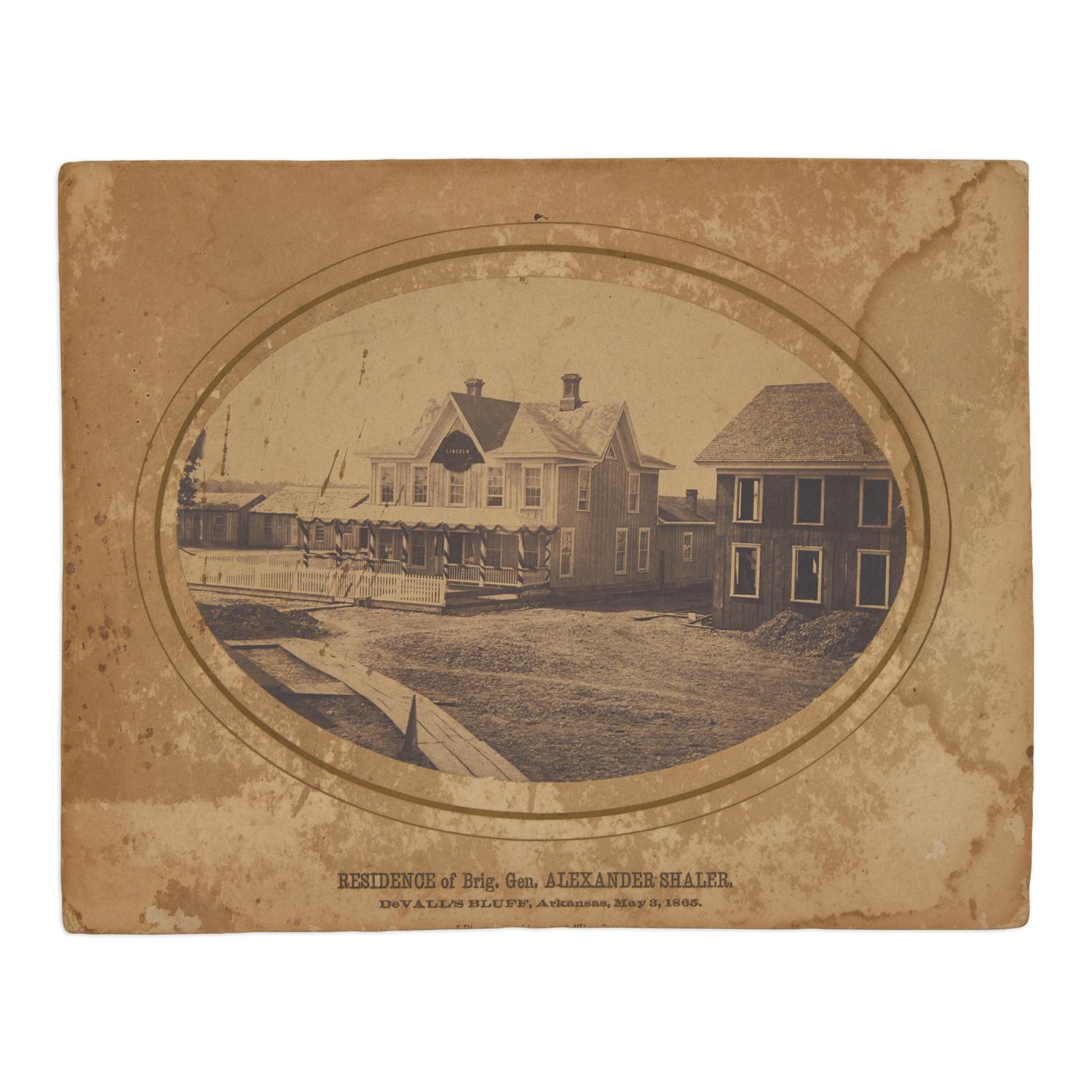 [Lincoln, Abraham]. A group of 3 photographs showing buildings and monuments draped in mourning.