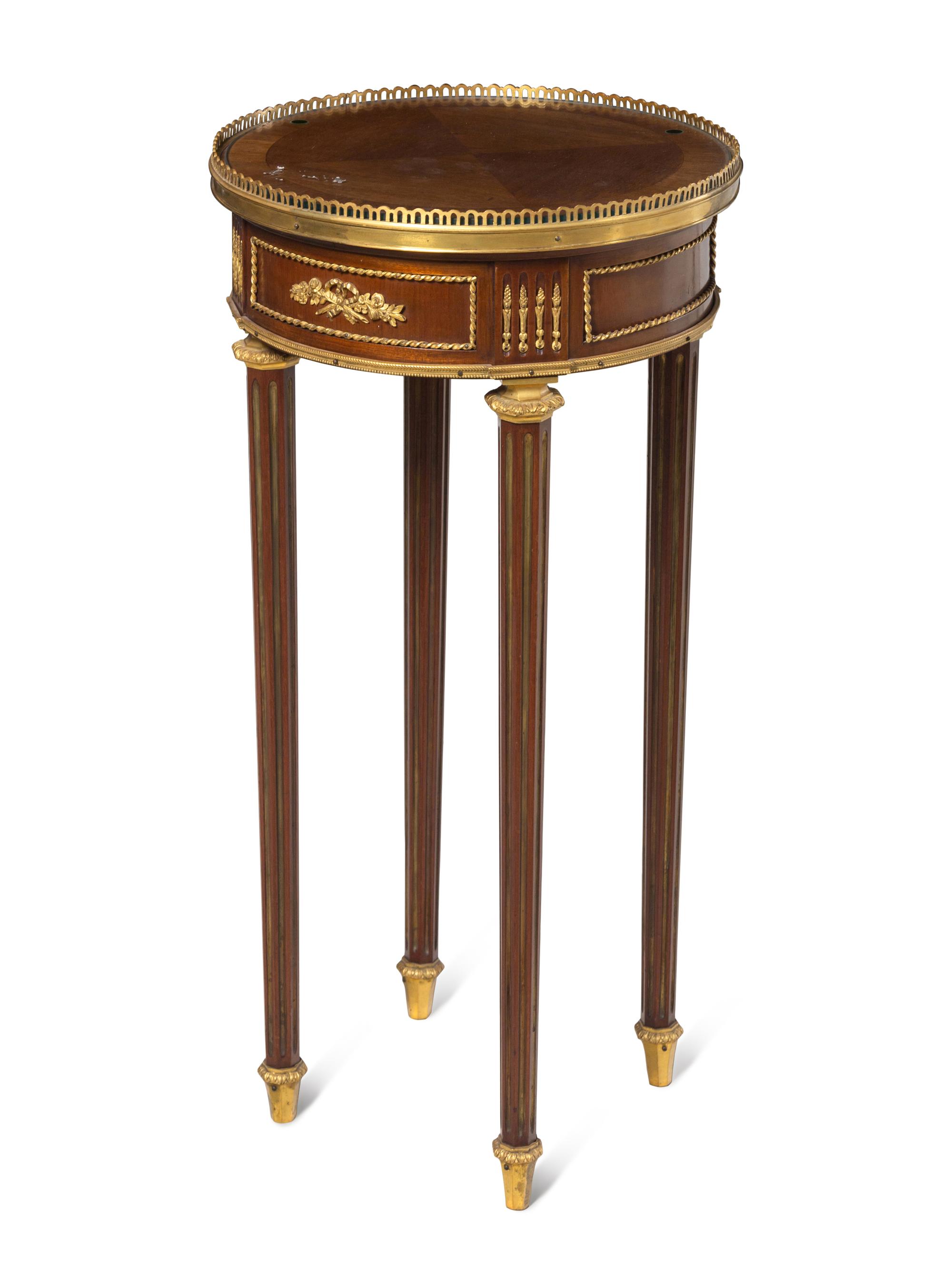 A Louis XVI Gilt Bronze Mounted Side Table