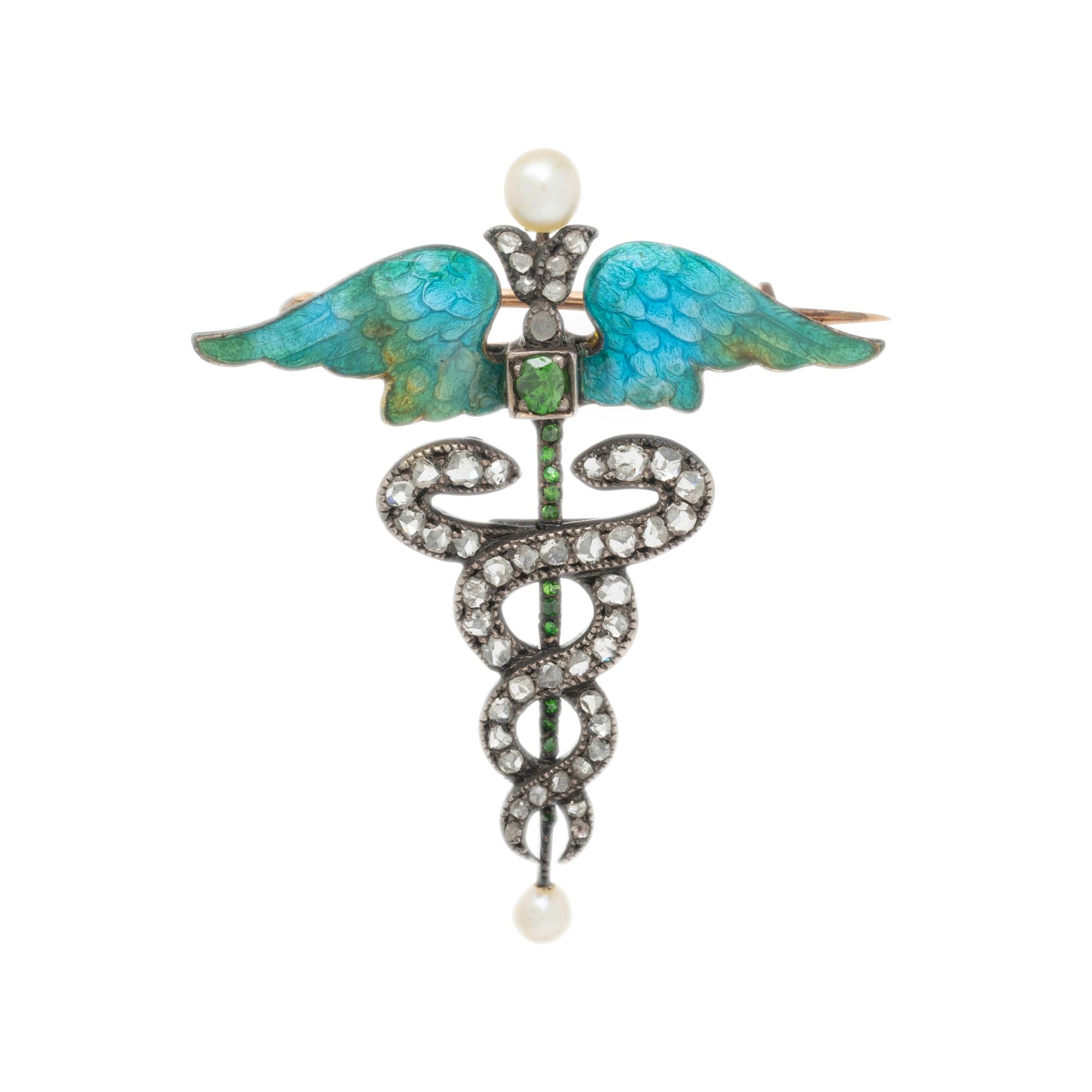 ART NOUVEAU, DIAMOND, SEED PEARL, DEMANTOID GARNET, AND ENAMEL CADUCEUS BROOCH