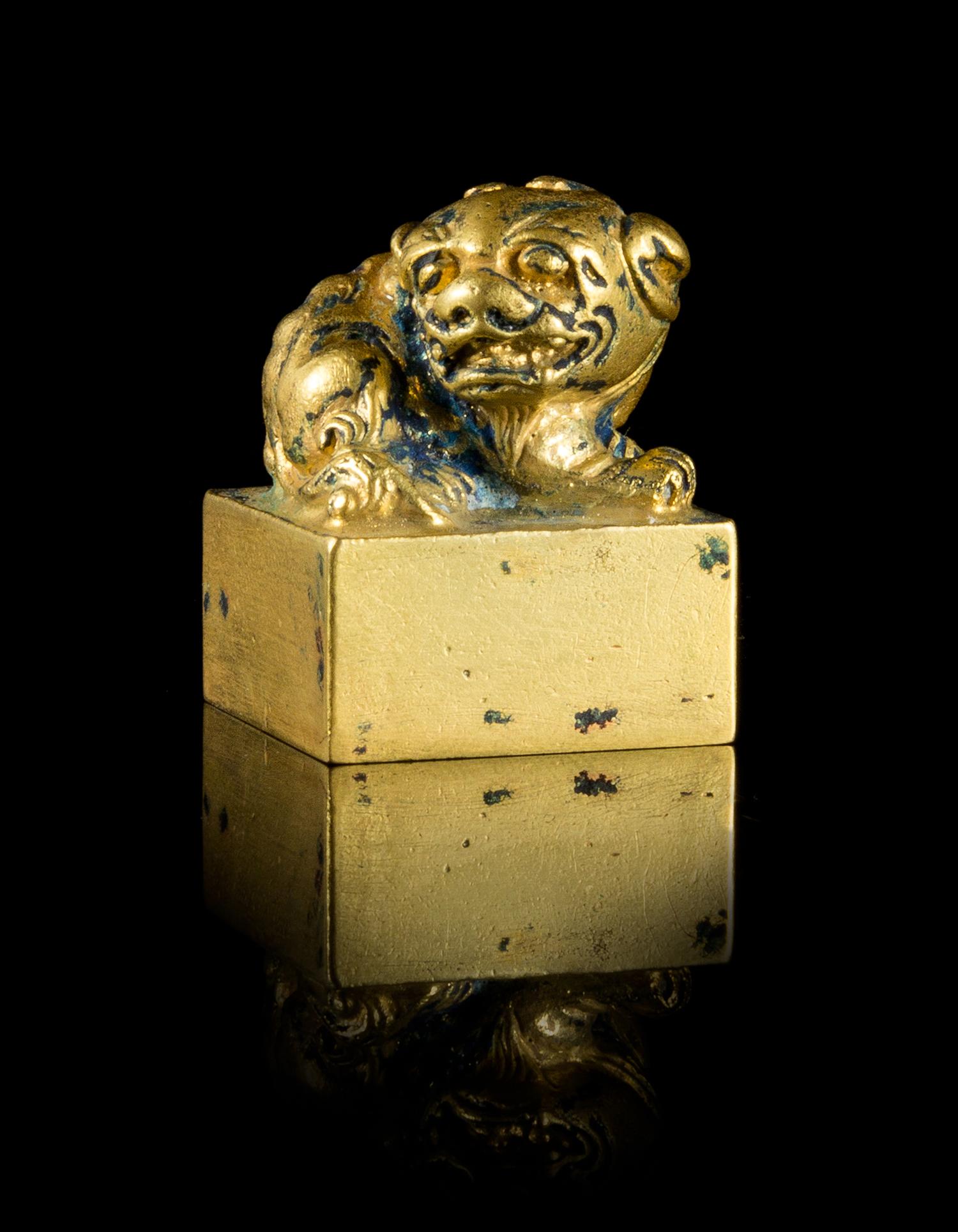 A Small Gilt Bronze Seal Length 1 1/8 x width 1 1/8 x height 1 5/8 inches.
