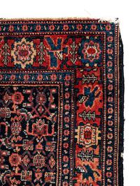 A Persian Senneh Wool Rug