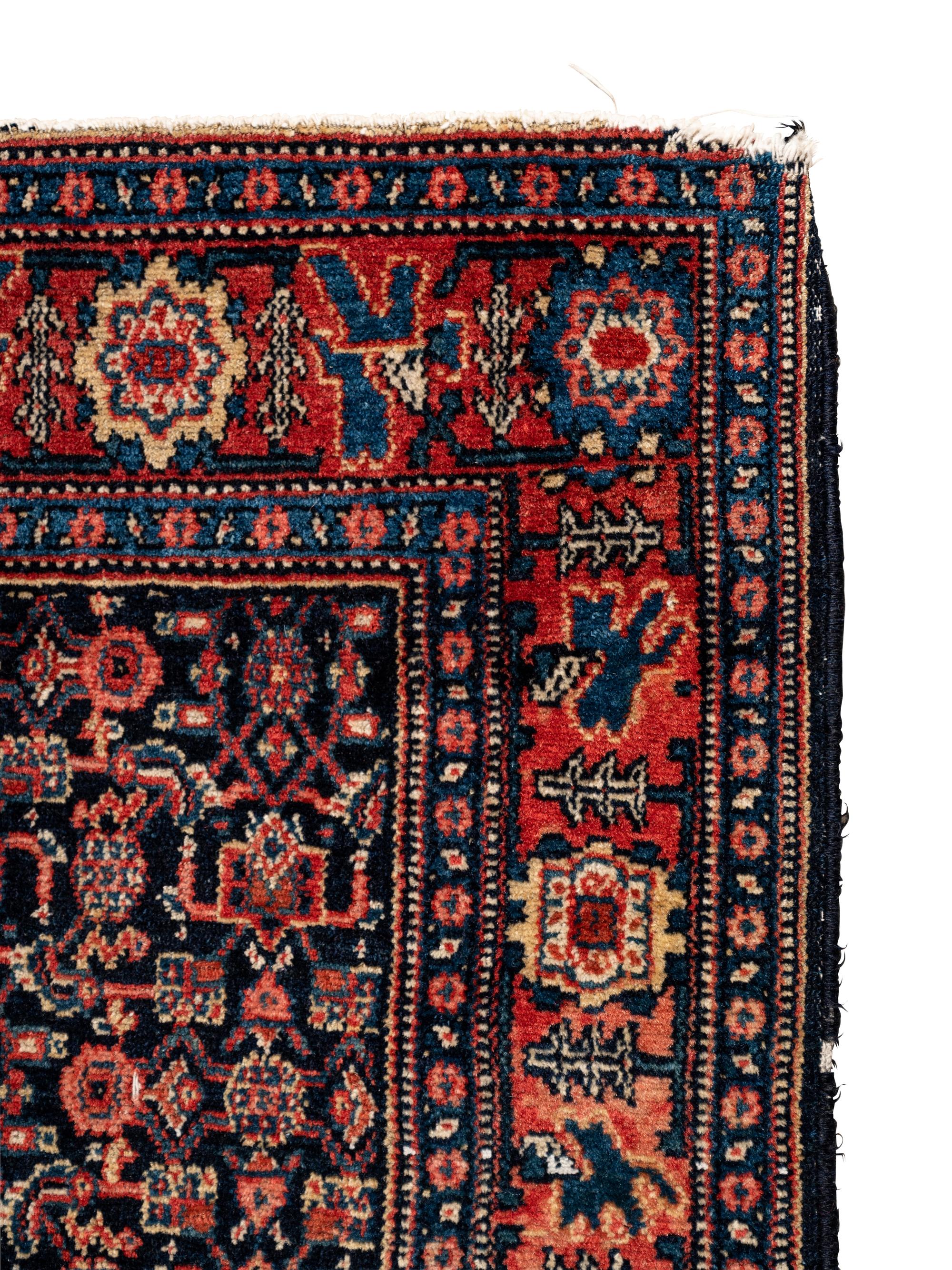 A Persian Senneh Wool Rug