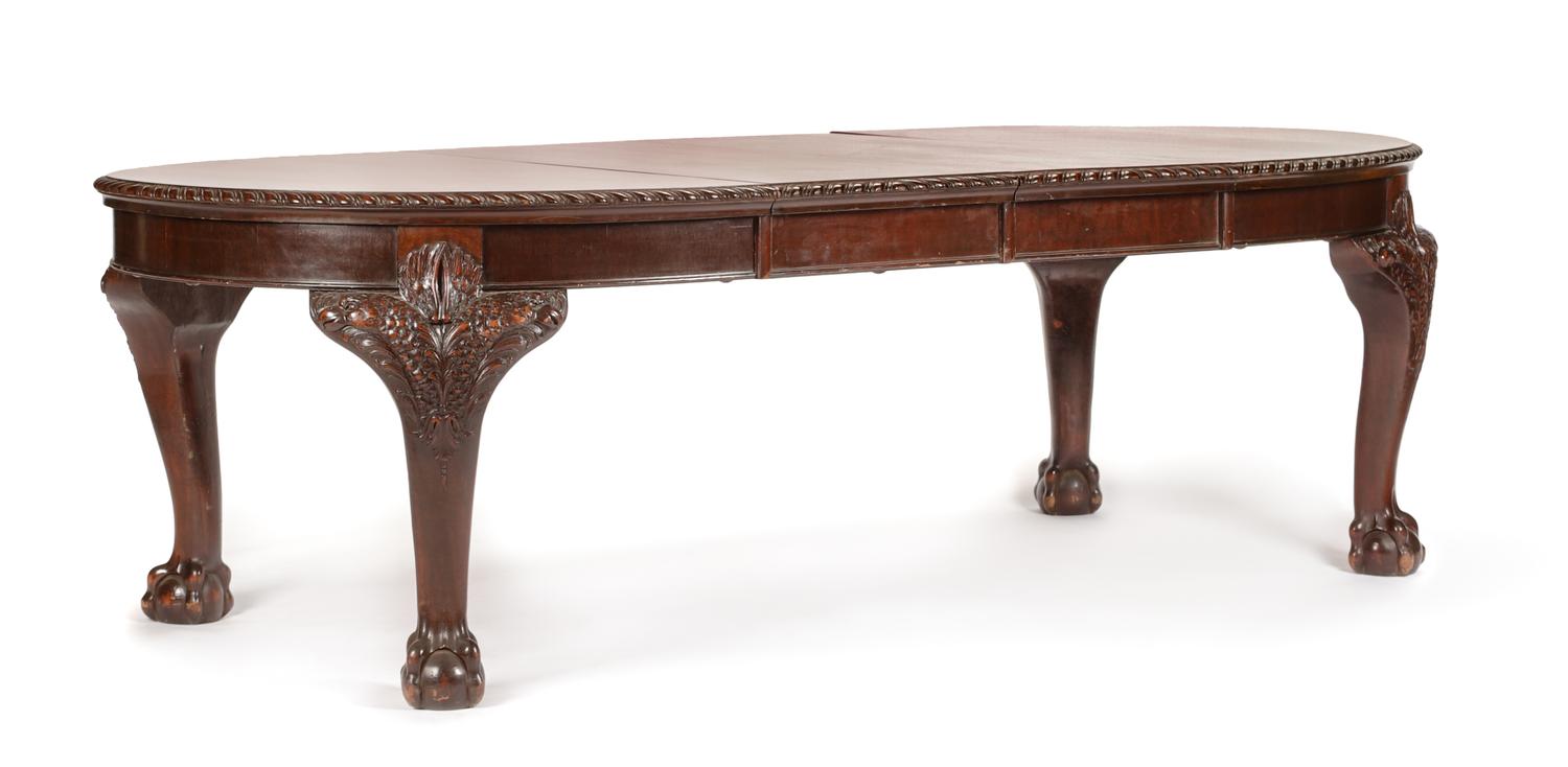 A George III Carved Mahogany Dining Table Height 29 x width 44 inches (closed). — CIRCA 1800