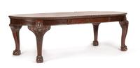 A George III Carved Mahogany Dining Table Height 29 x width 44 inches (closed). — CIRCA 1800