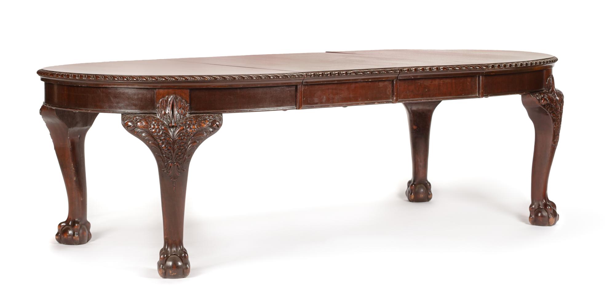 A George III Carved Mahogany Dining Table Height 29 x width 44 inches (closed). — CIRCA 1800