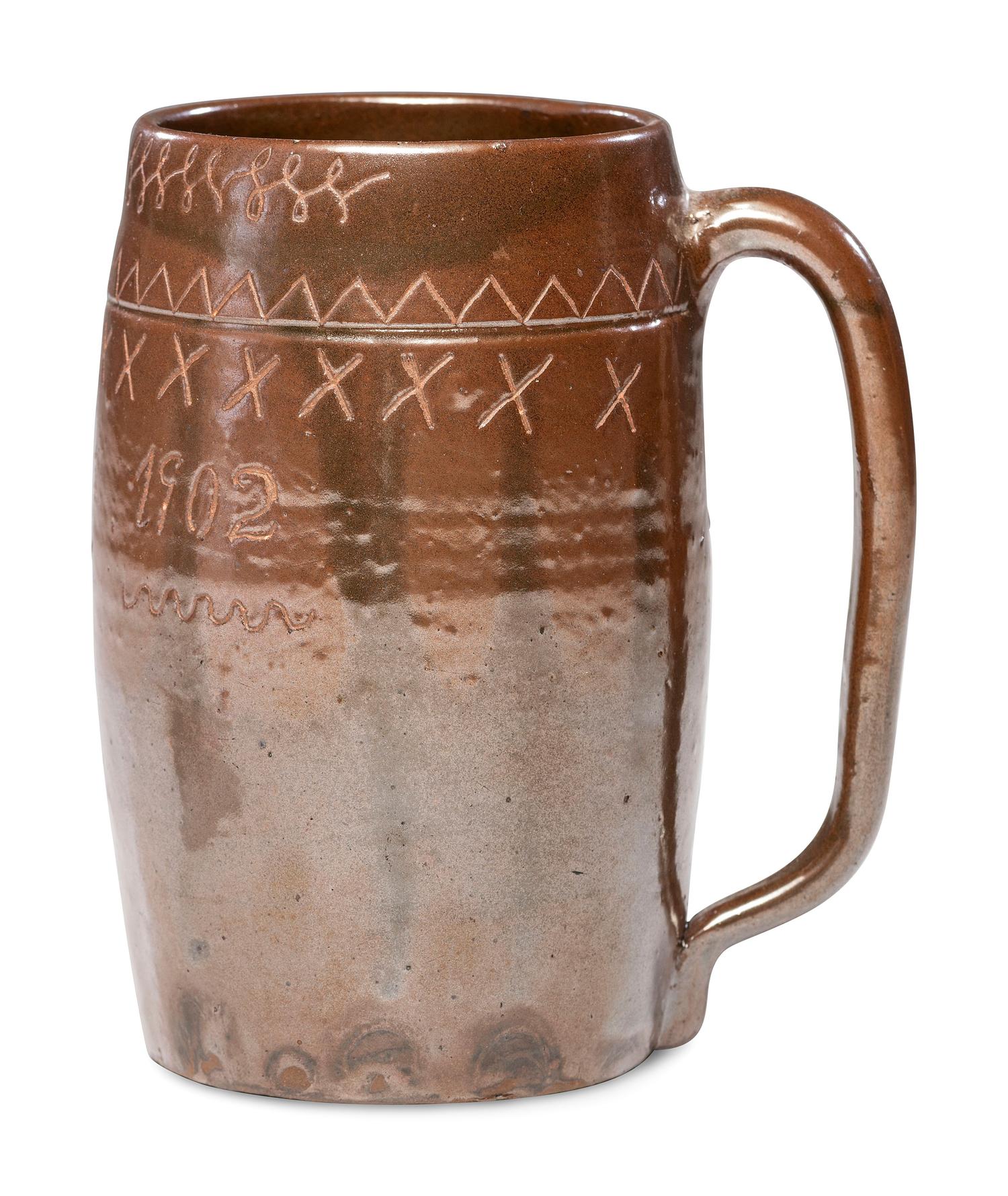 A Heavily Incised Albany Slip-Glazed Stoneware Beer Mug