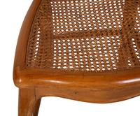 A French Provincial Style Fruitwood Dining Table and Six Side Chairs — 20TH CENTURY