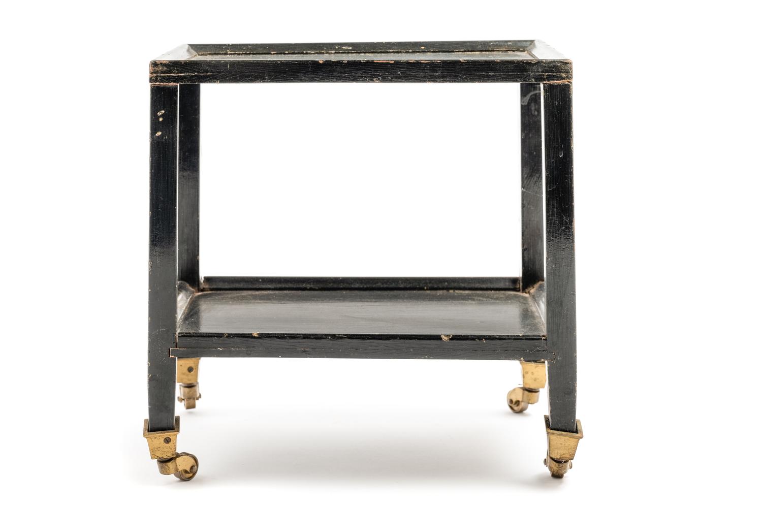 A Black Painted "Telephone Table" in the Style of Karl Springer