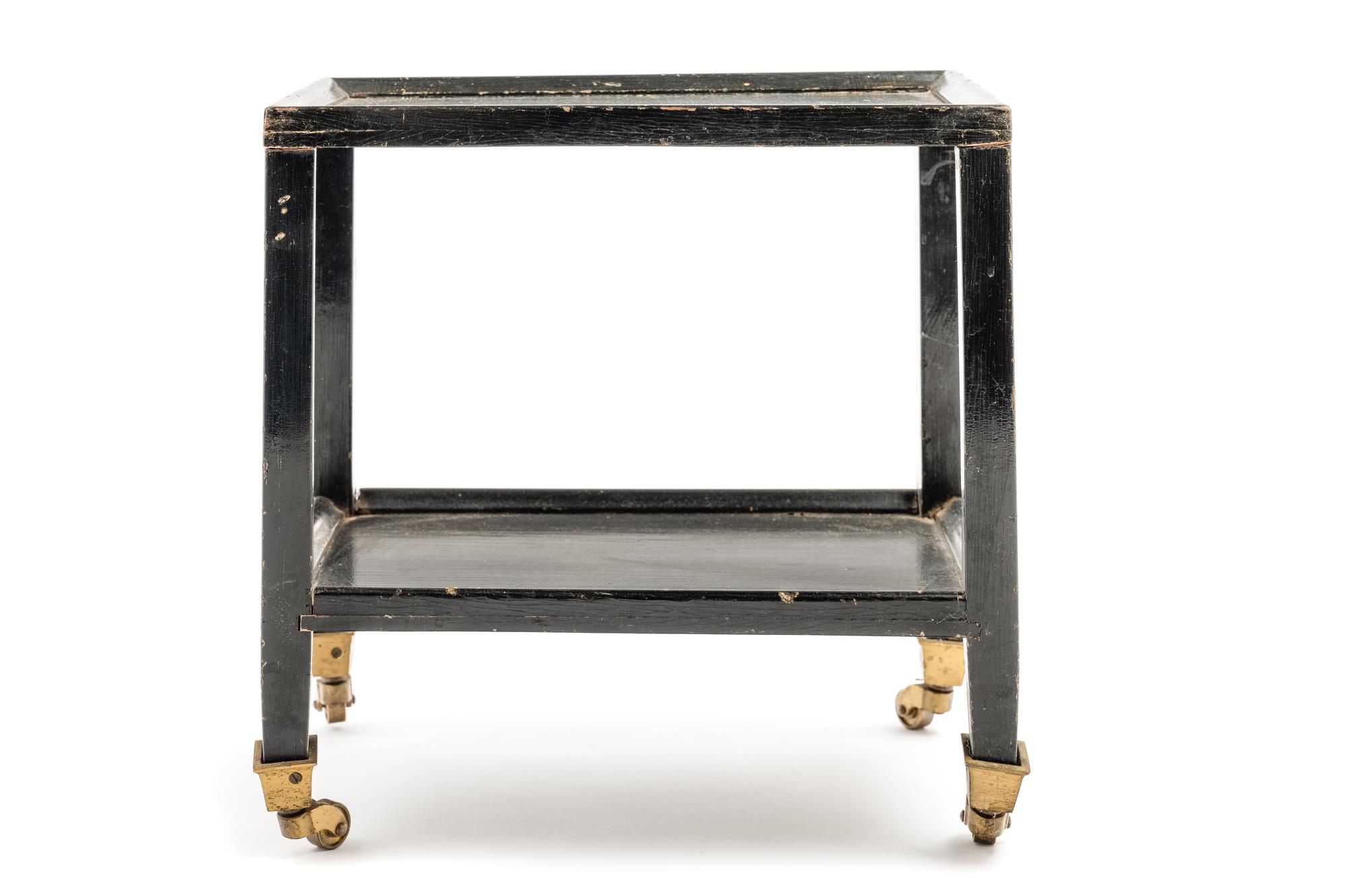 A Black Painted "Telephone Table" in the Style of Karl Springer