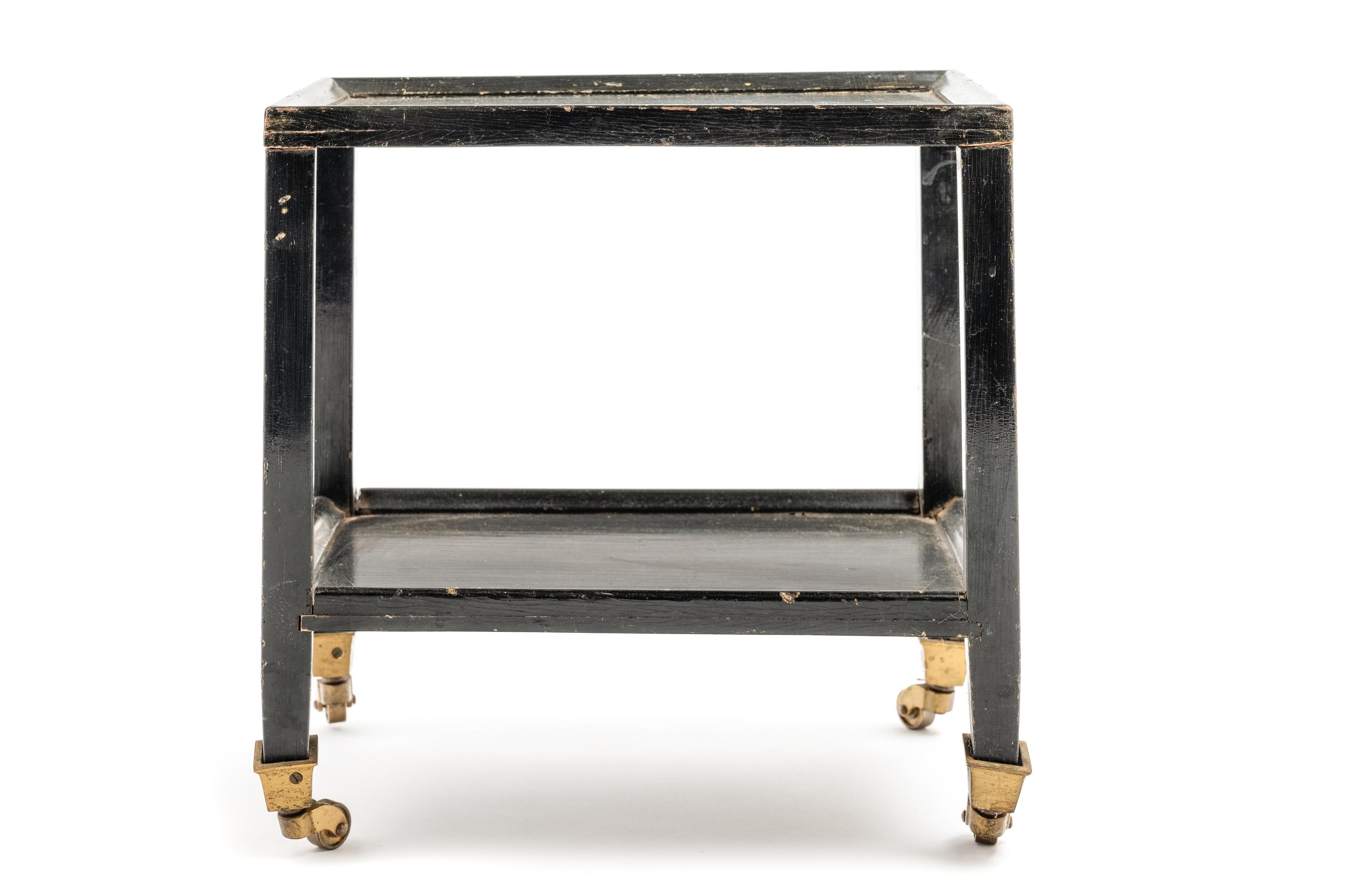 A Black Painted "Telephone Table" in the Style of Karl Springer