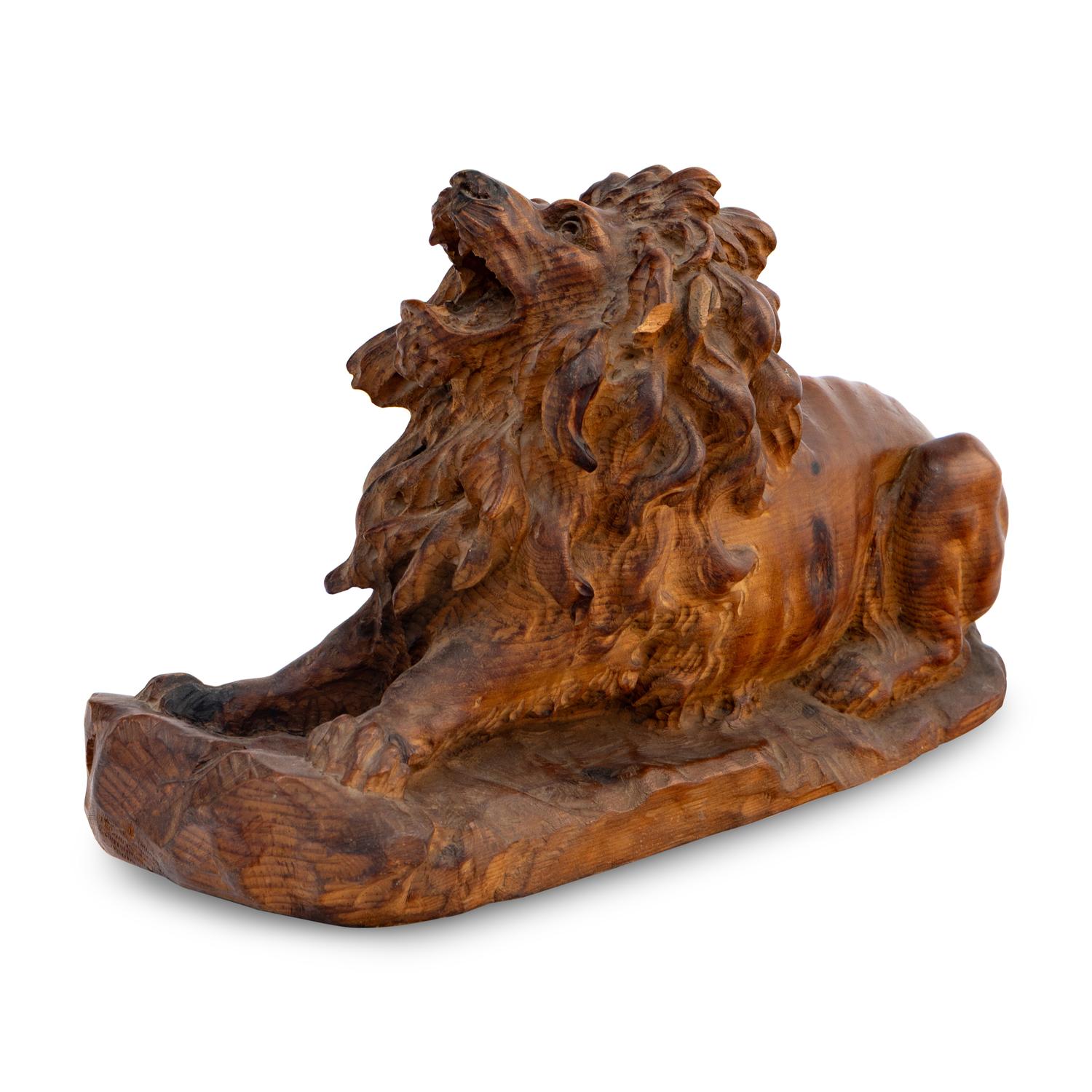 A Carved Oak Model of a Lion