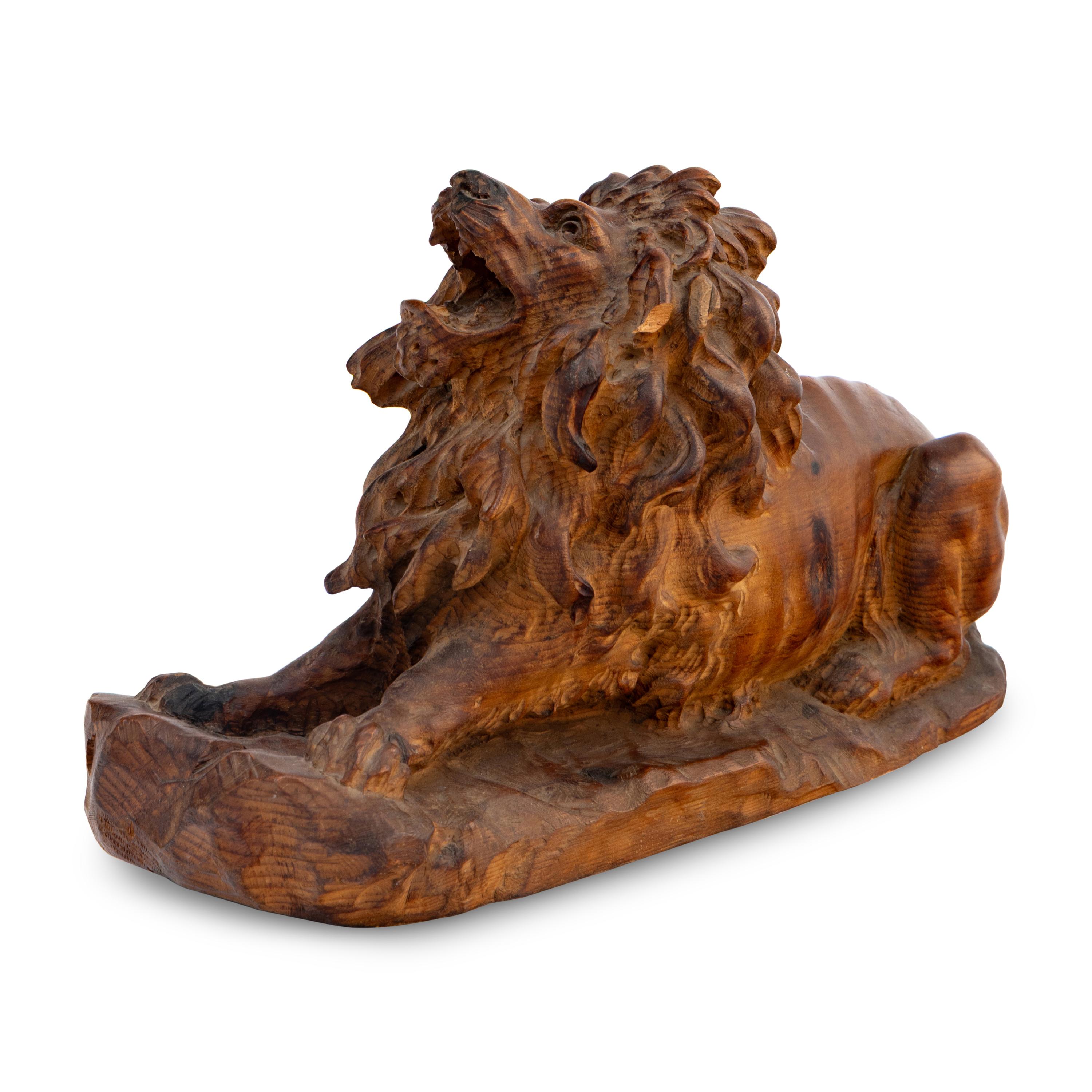 A Carved Oak Model of a Lion