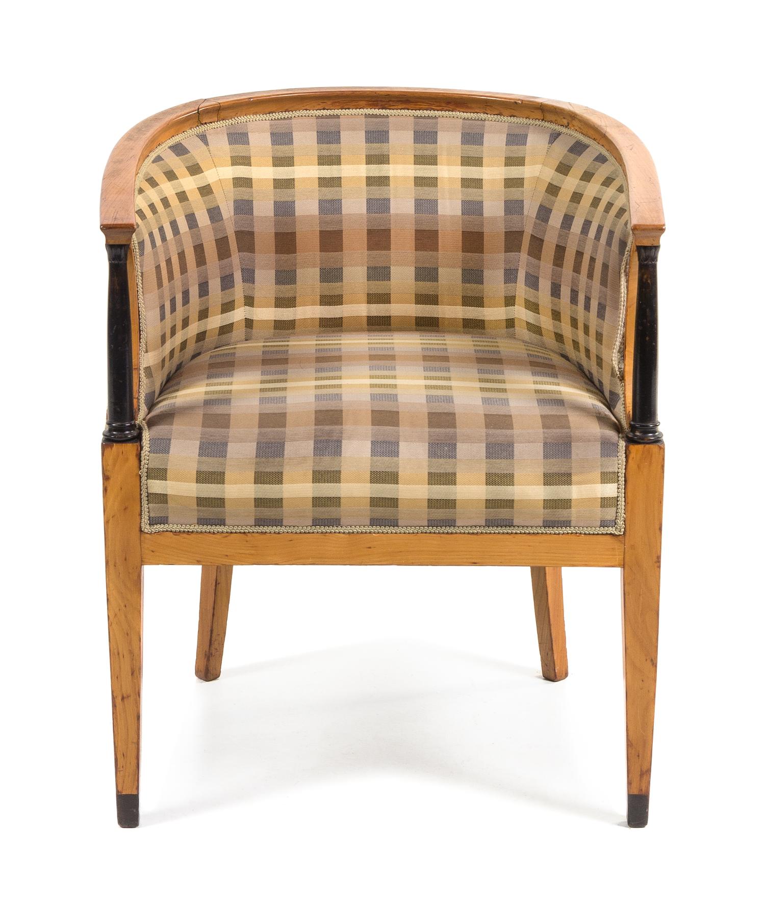 A Biedermeier Parcel Ebonized Tub Chair Height 29 inches. — SECOND QUARTER 19TH CENTURY