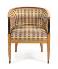 A Biedermeier Parcel Ebonized Tub Chair Height 29 inches. — SECOND QUARTER 19TH CENTURY
