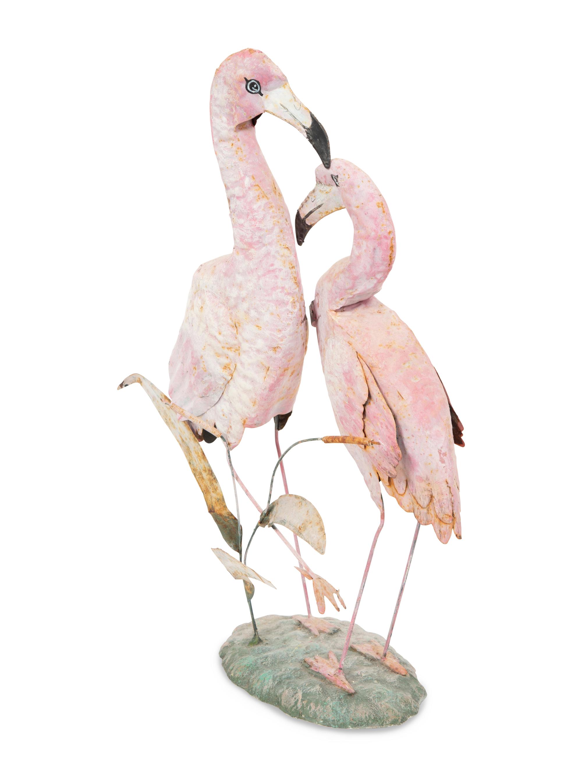 A Tole Peint Model of Two Flamingos and a Glazed Earthenware Model of a Flamingo
