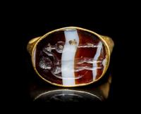 A Roman Gold and Banded Agate Finger Ring with a Warrior