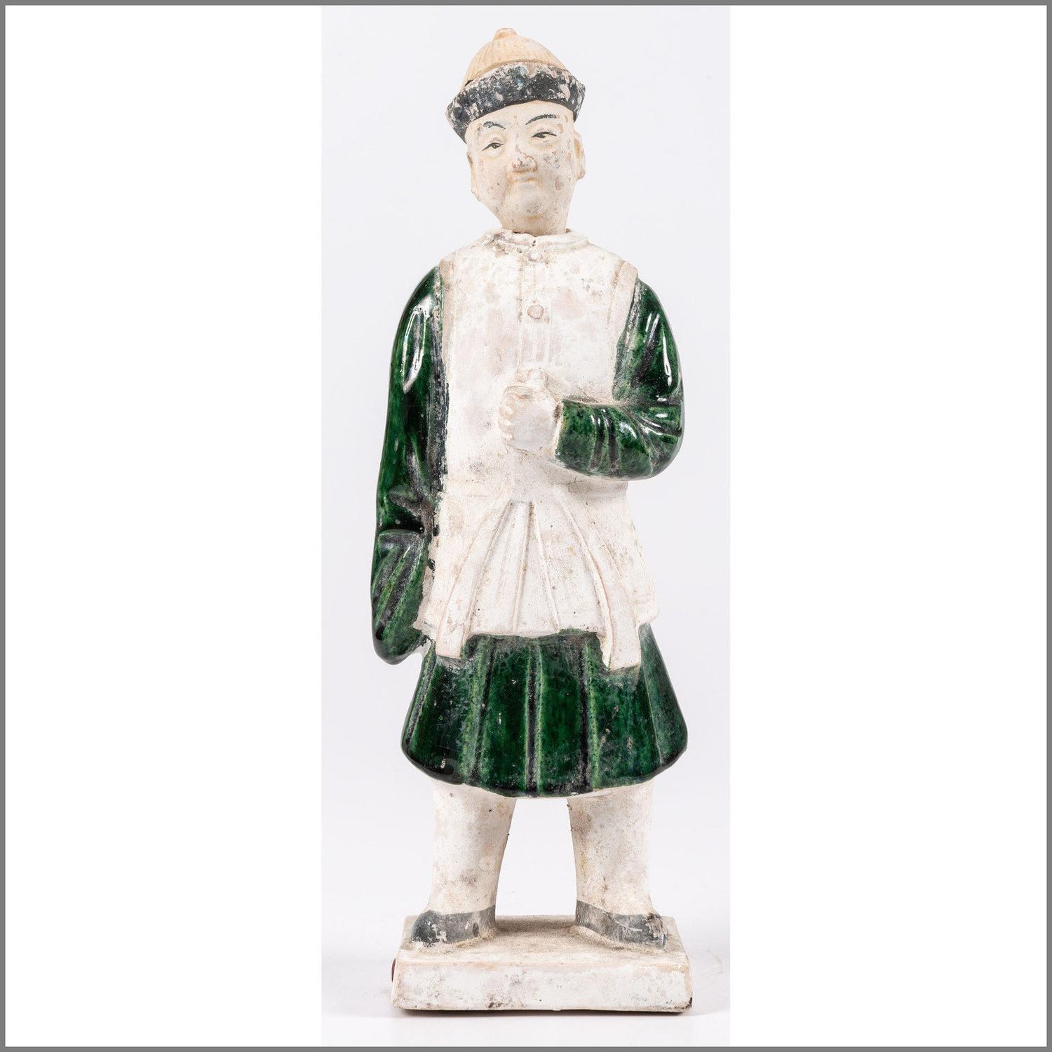 A Chinese Terracotta Figure with Polychrome Decoration