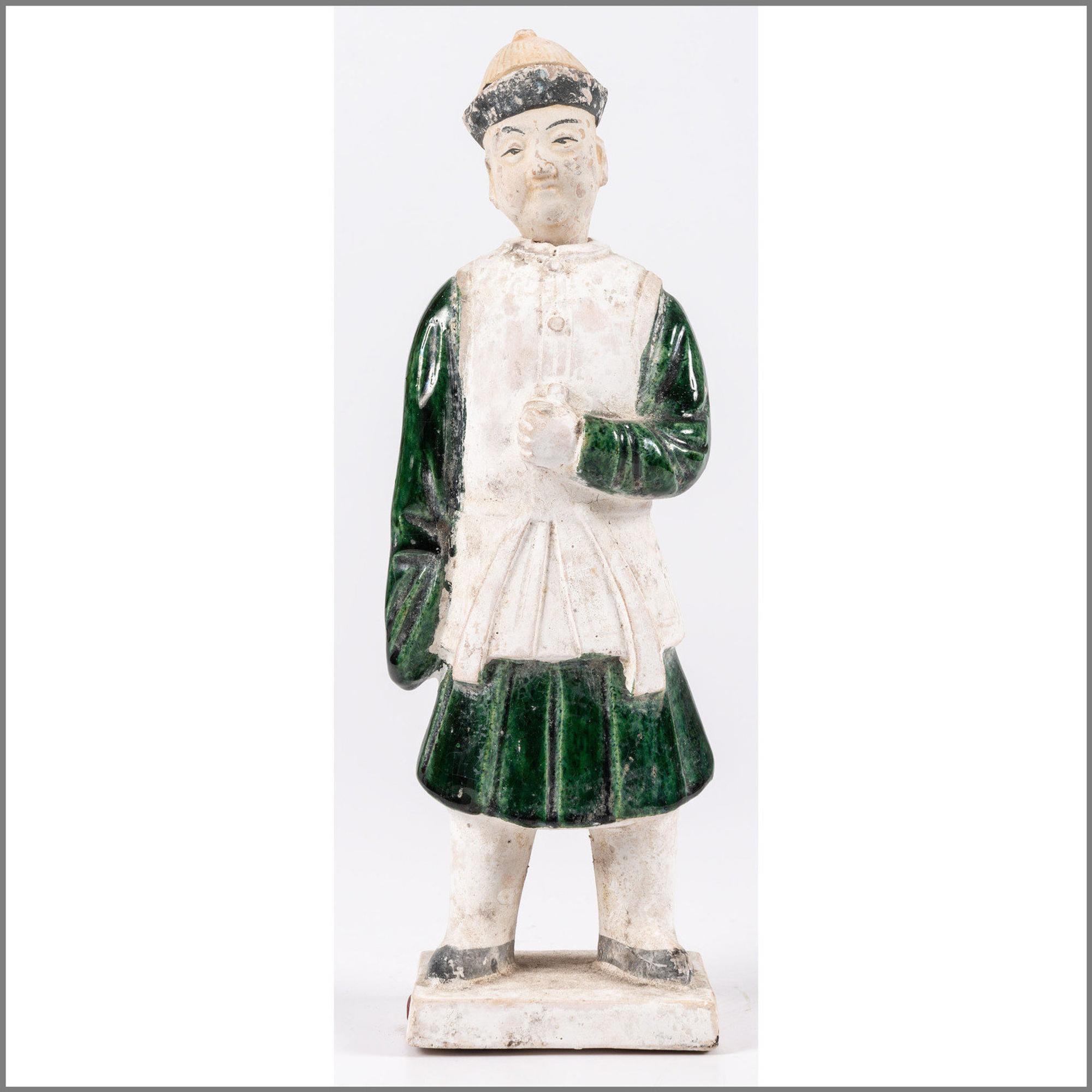 A Chinese Terracotta Figure with Polychrome Decoration
