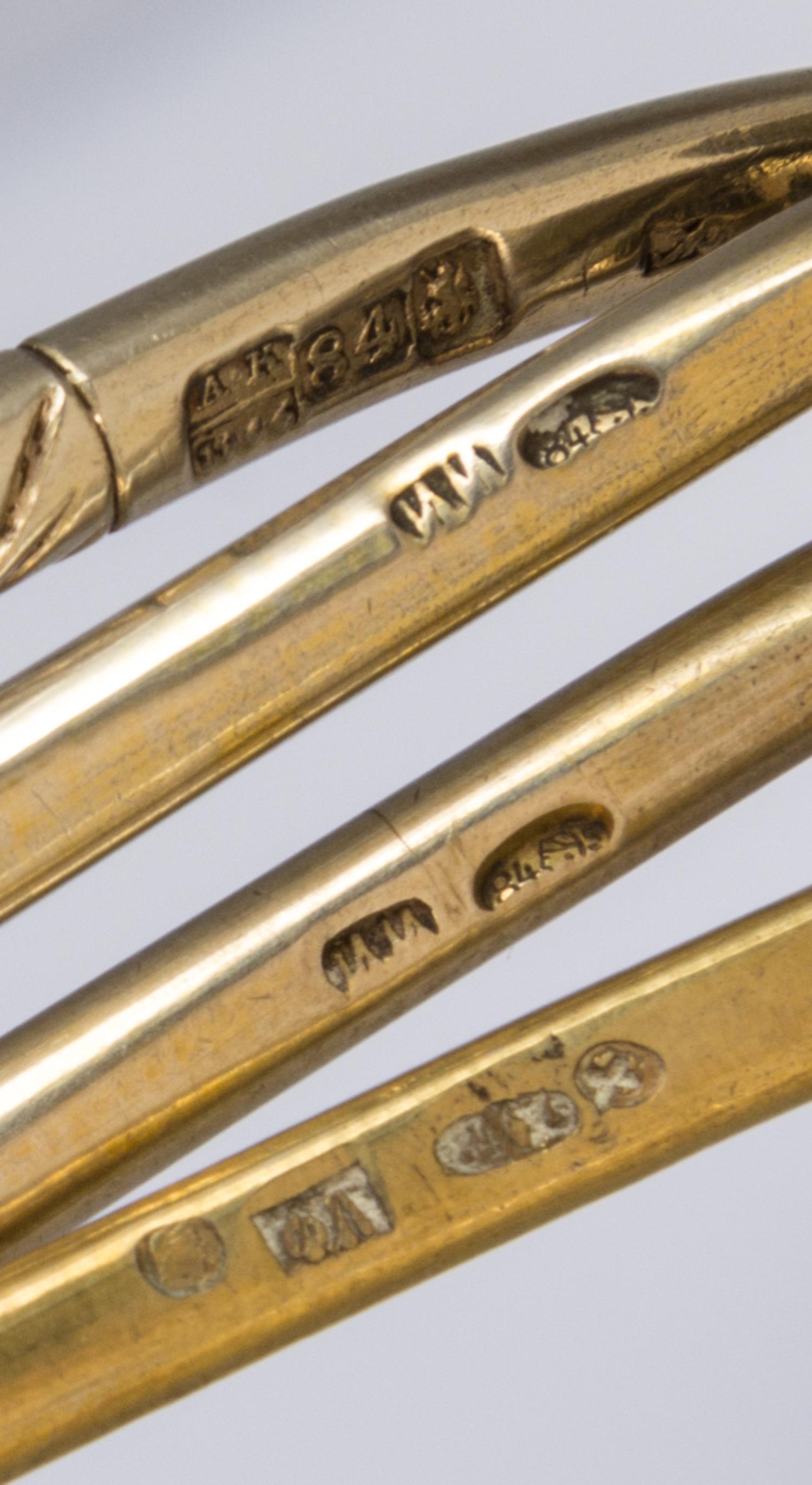 Four Russian Silver-Gilt and Niello Spoons, Various makers, Moscow, 19th Century, each having a spherical finial surmounting a twist ha
