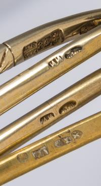 Four Russian Silver-Gilt and Niello Spoons, Various makers, Moscow, 19th Century, each having a spherical finial surmounting a twist ha