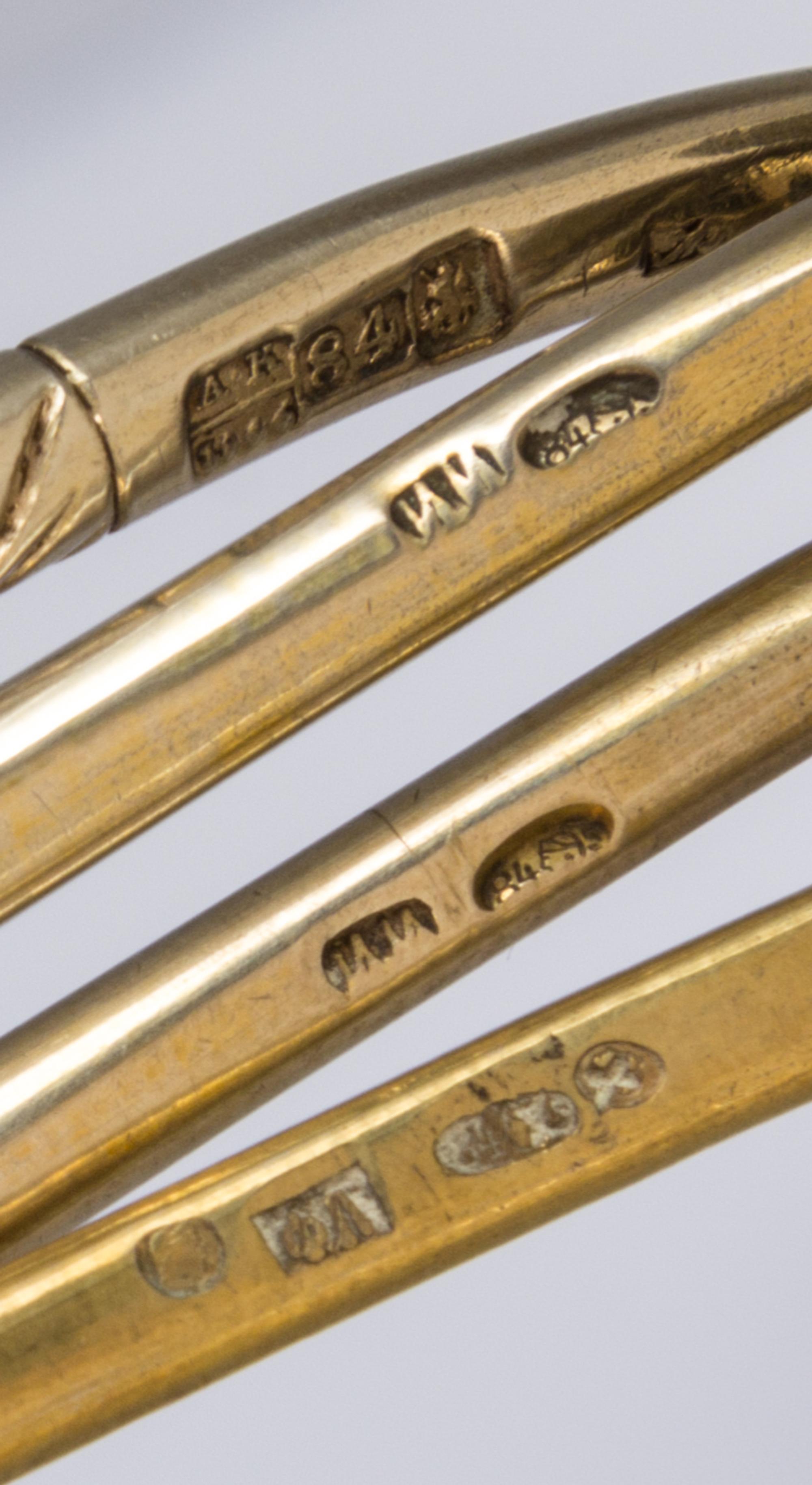 Four Russian Silver-Gilt and Niello Spoons, Various makers, Moscow, 19th Century, each having a spherical finial surmounting a twist ha