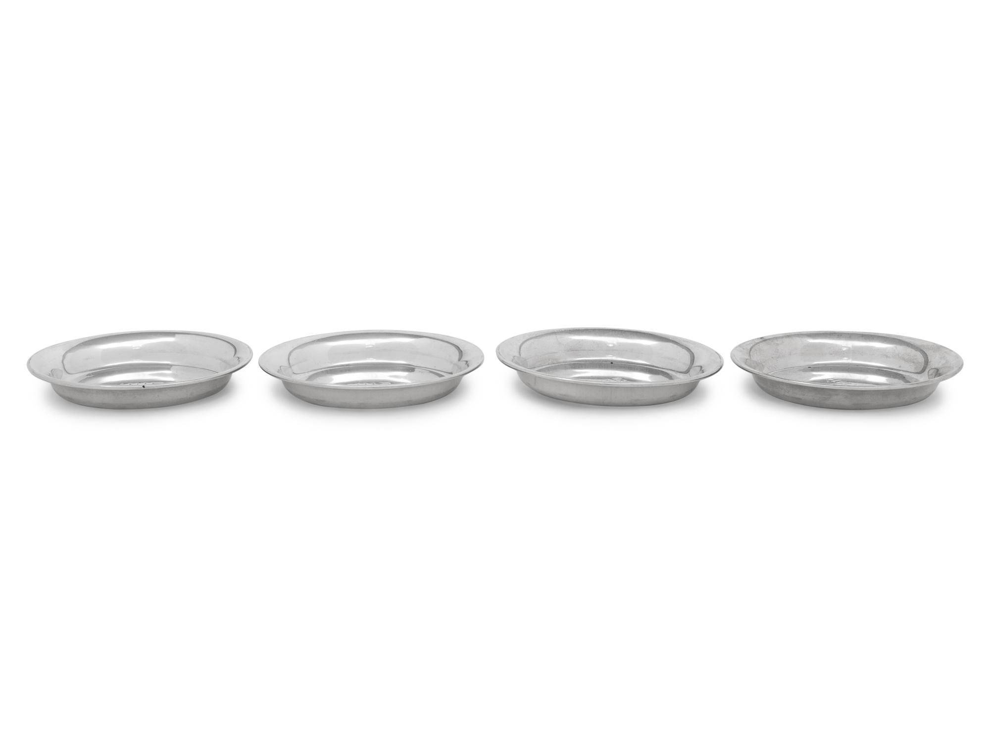 A Set of Four S. Kirk and Son Silver Butter Pats