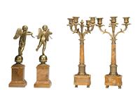 A Pair of Brass and Marble Cherub Bookends and Four-Light Candelabra