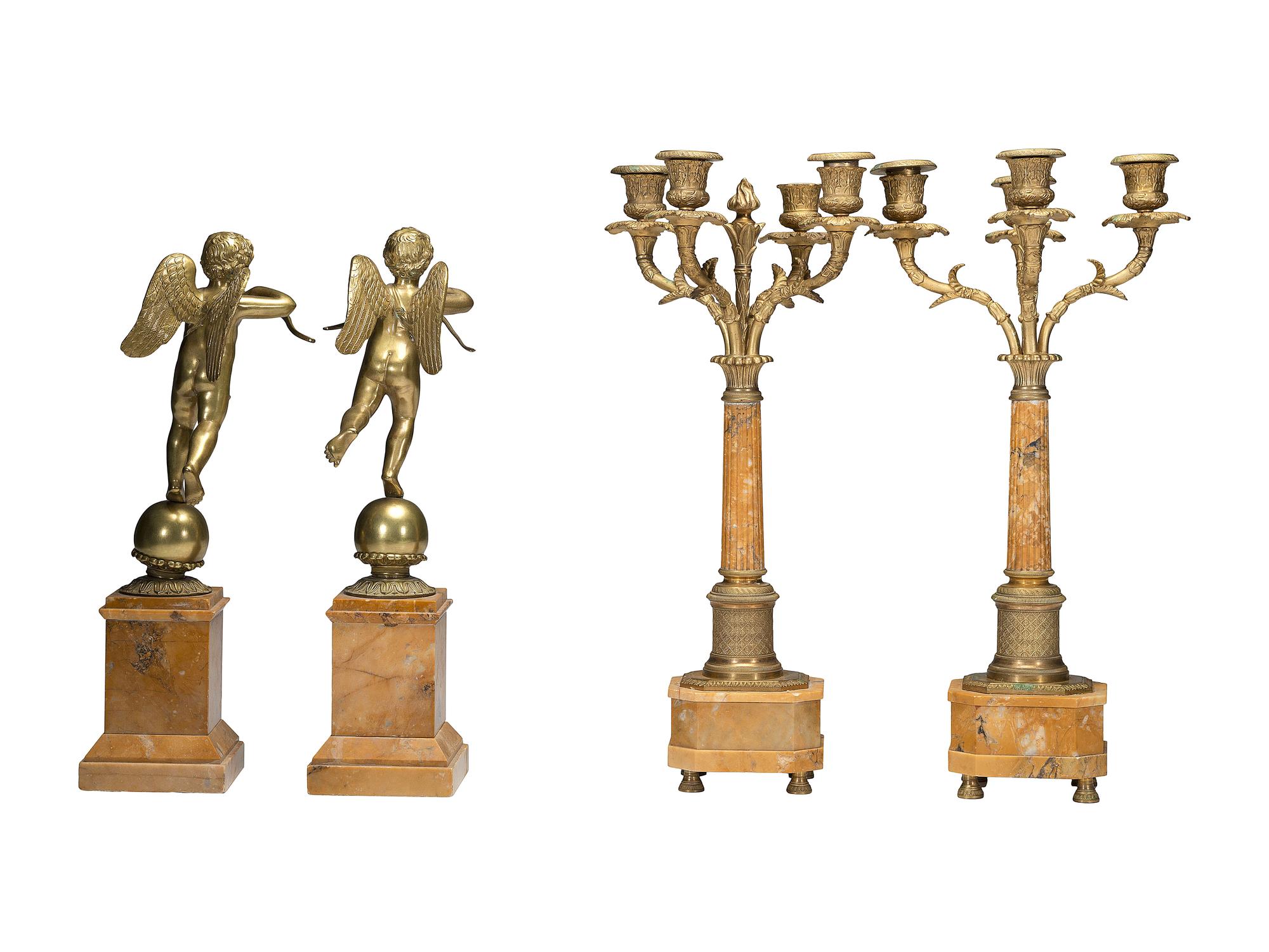 A Pair of Brass and Marble Cherub Bookends and Four-Light Candelabra